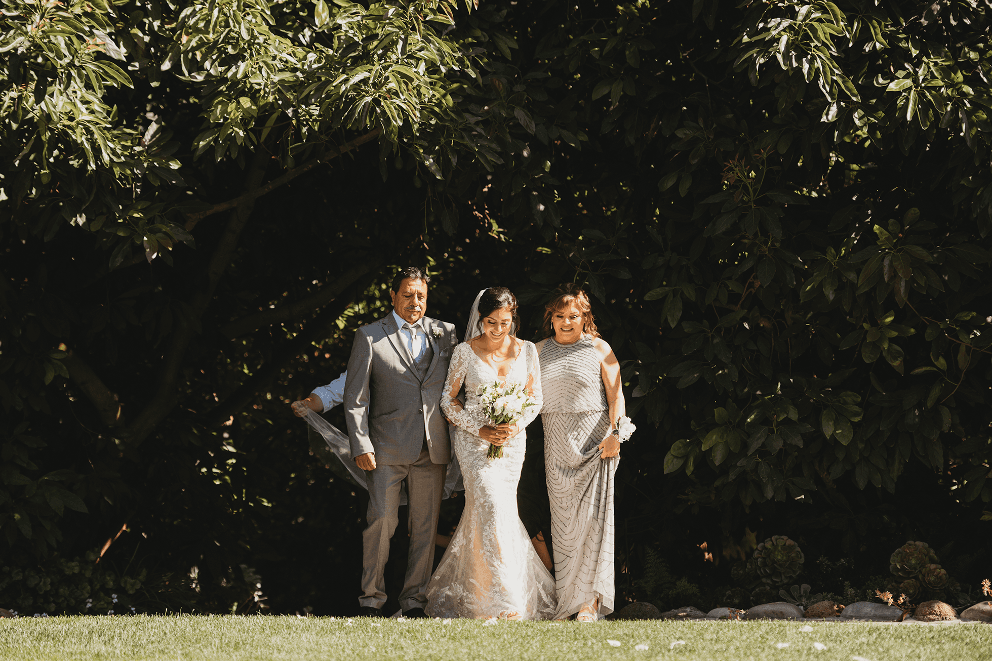 Flat lay wedding details with bouquet, rings, and sparkling bridal heels