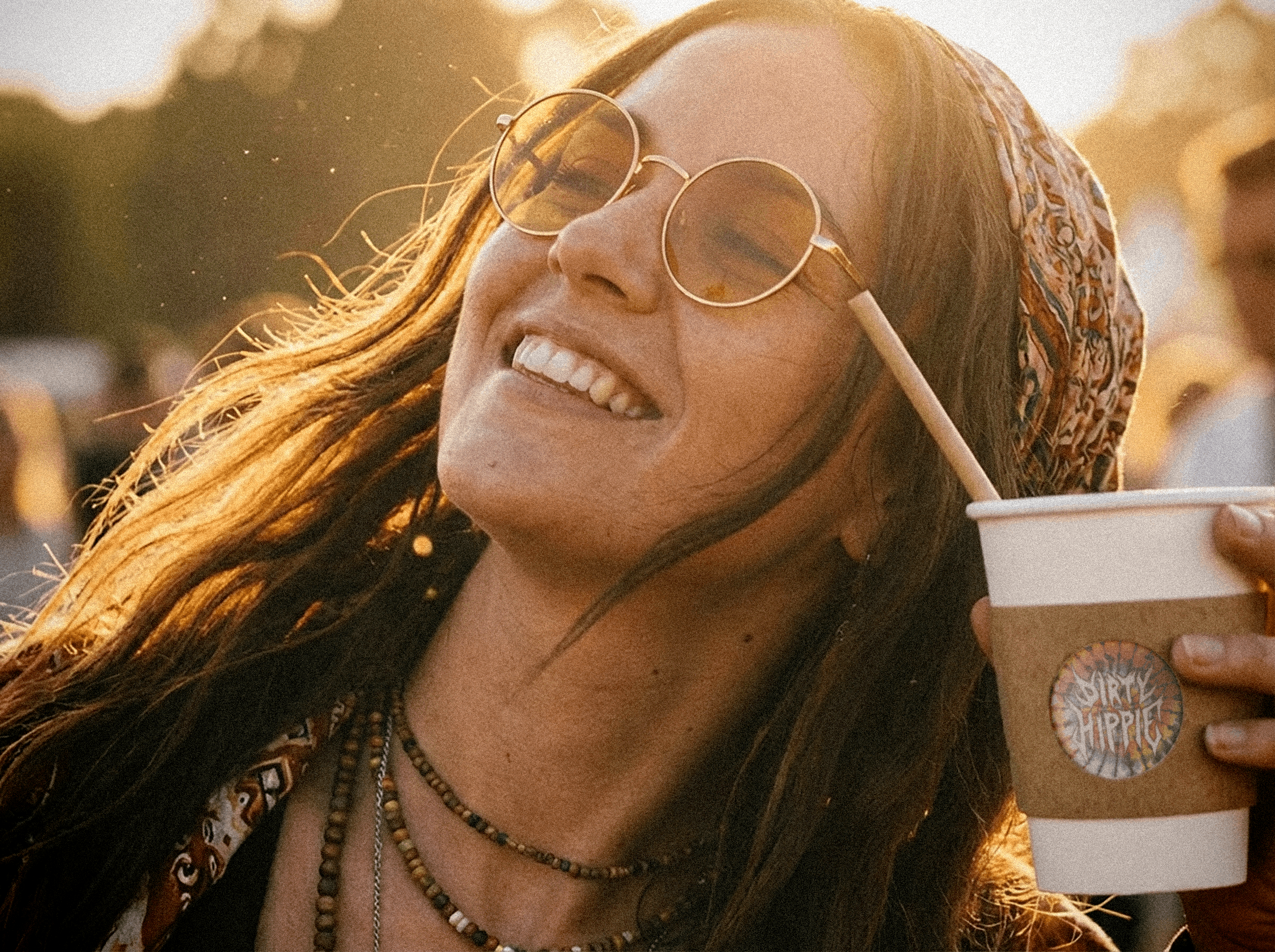 girl dancing with dirty hippie cup