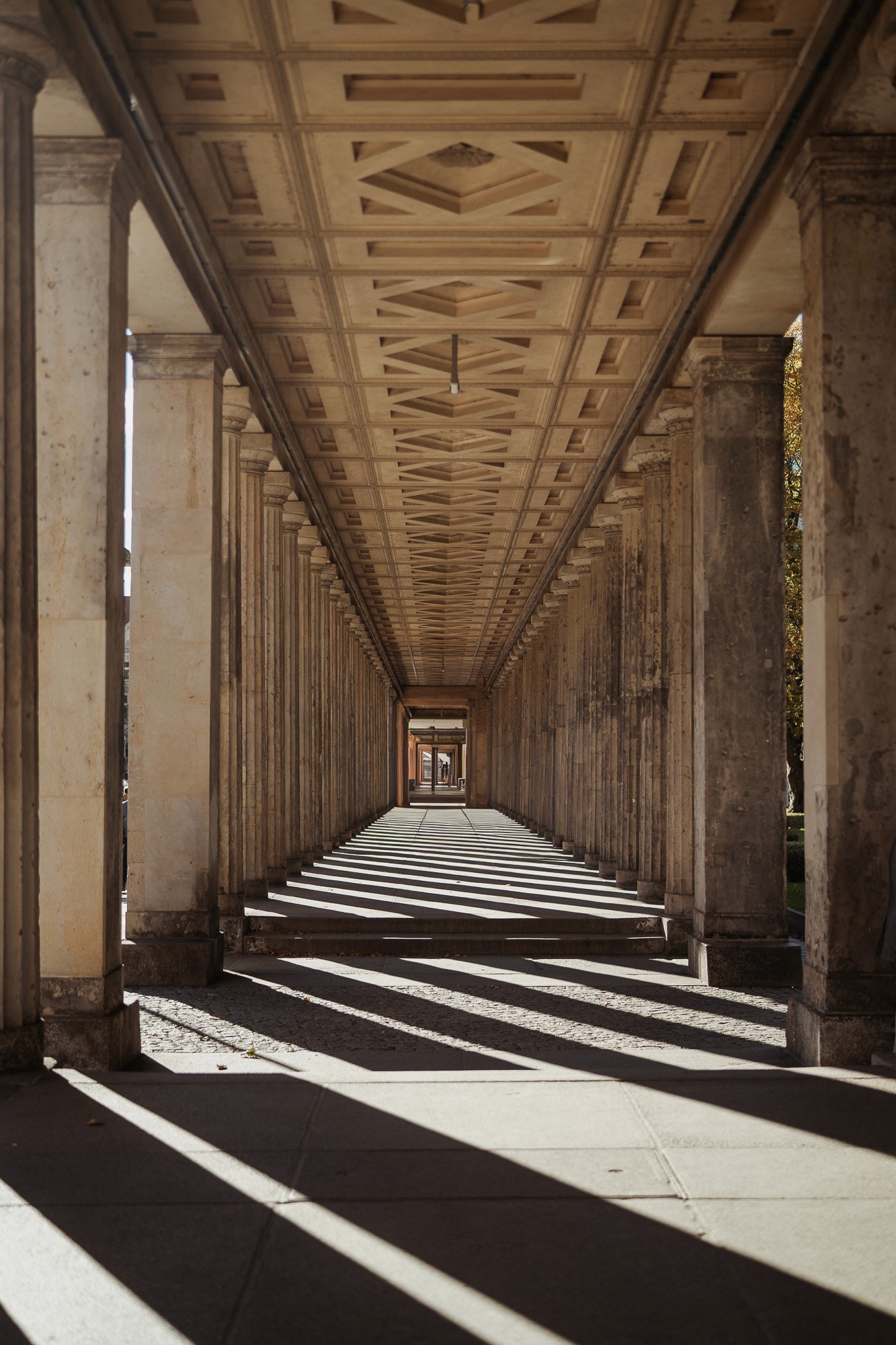 Symmetrical corridor of columns representing the pathway and precision of StoryOS narrative alignment