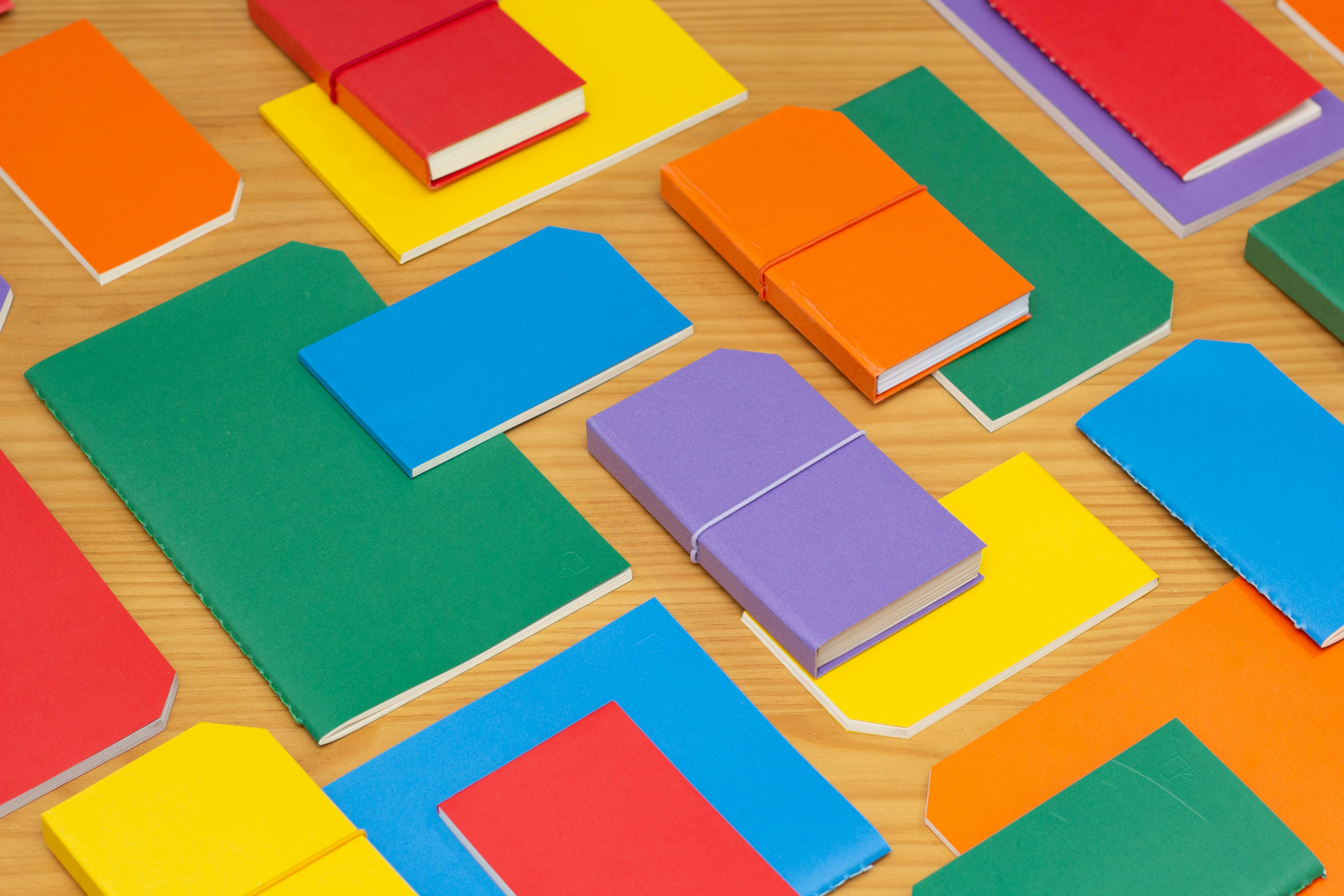 blue yellow red and green papers
