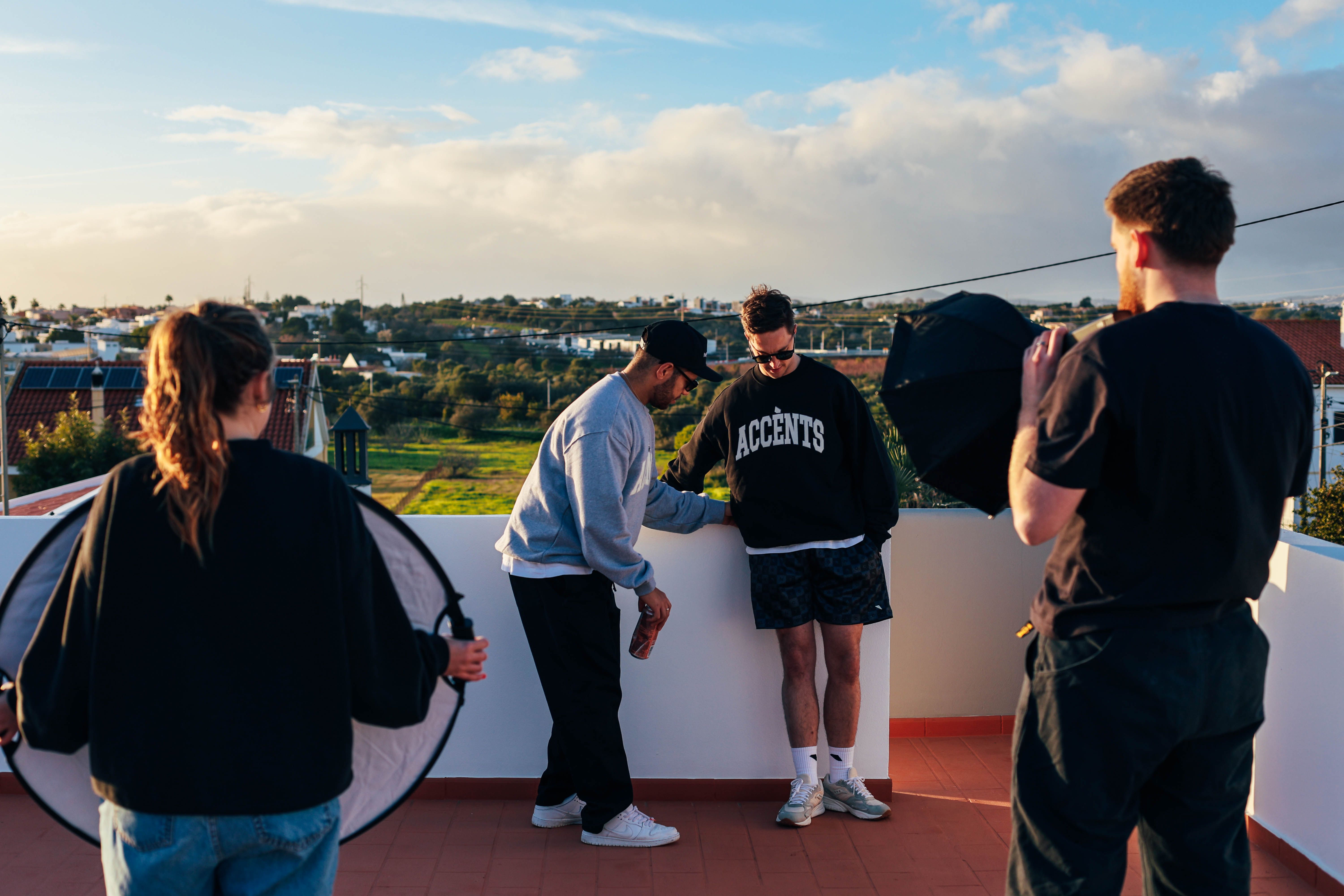 Behind the scenes shot of photographers and model