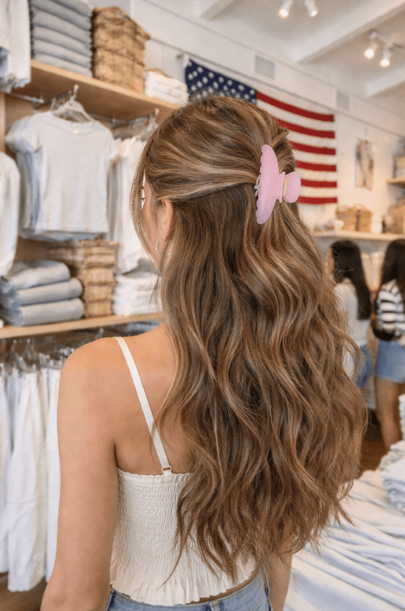 Young girl with backpack walks on dirt path
