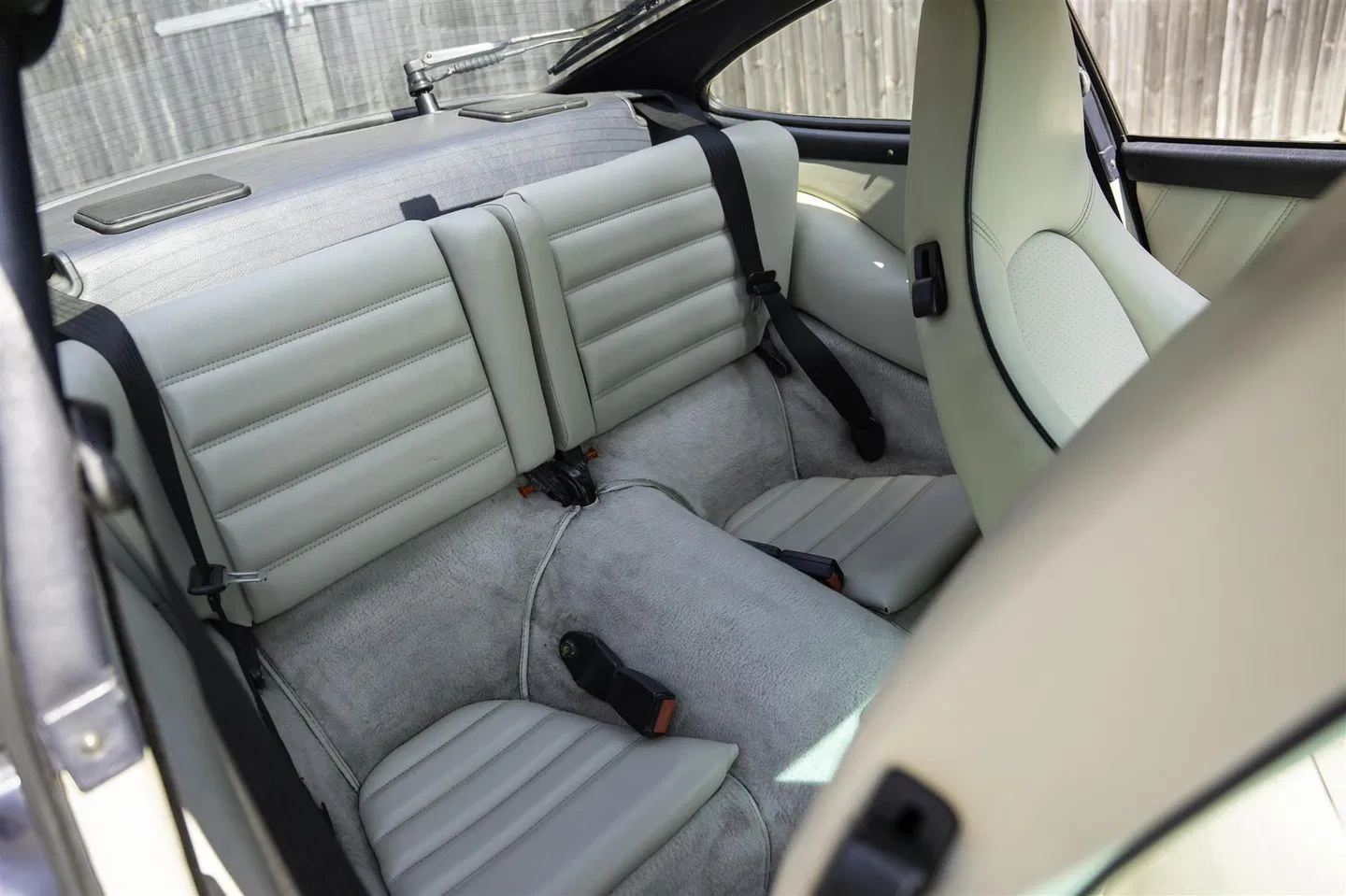 Rear seats trimmed in white leather with grey carpet