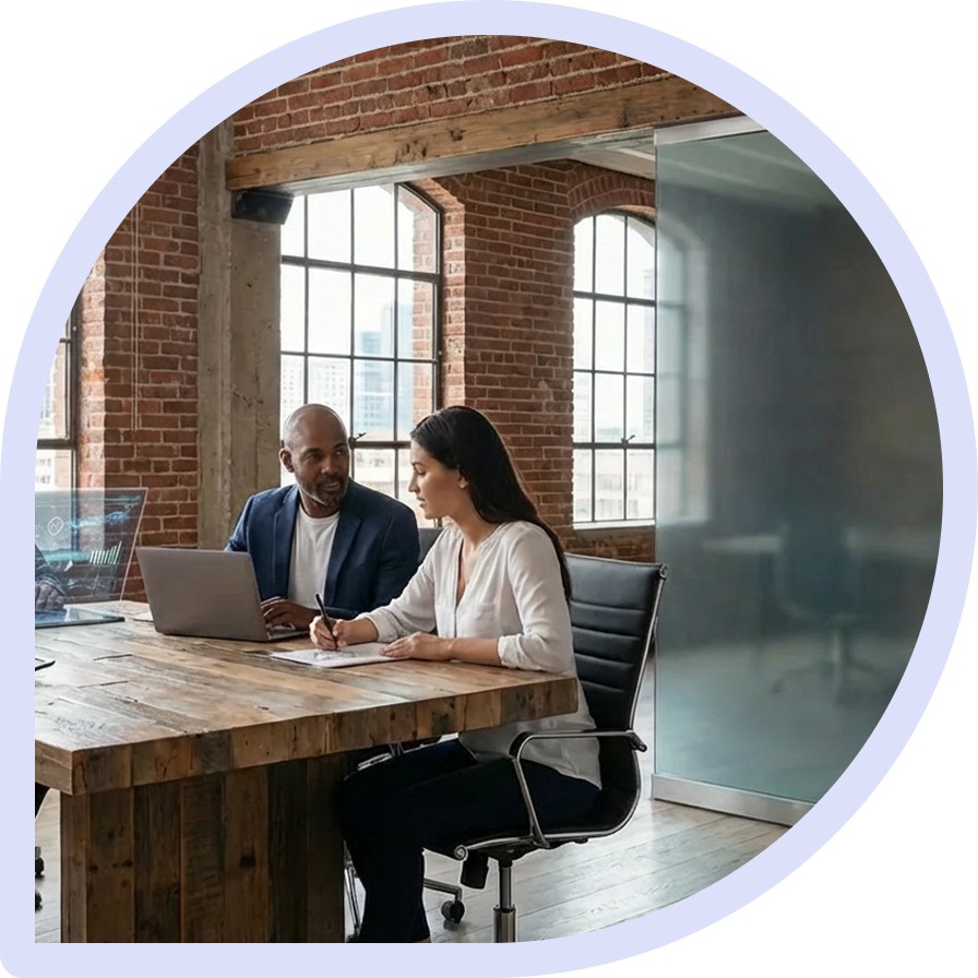Men and women working in large open office