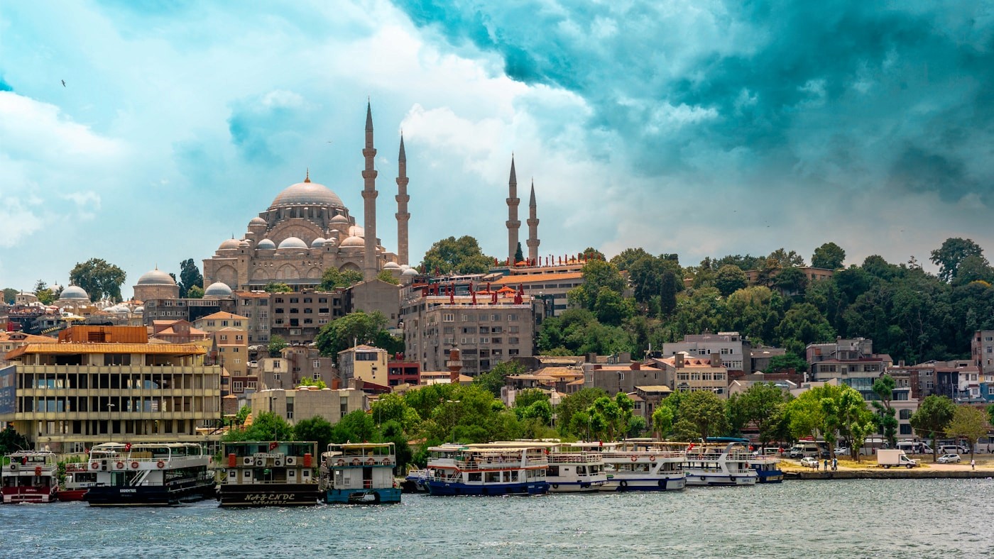 Istanbul skyline with mosques and boats on the Bosphorus on a hot summer day