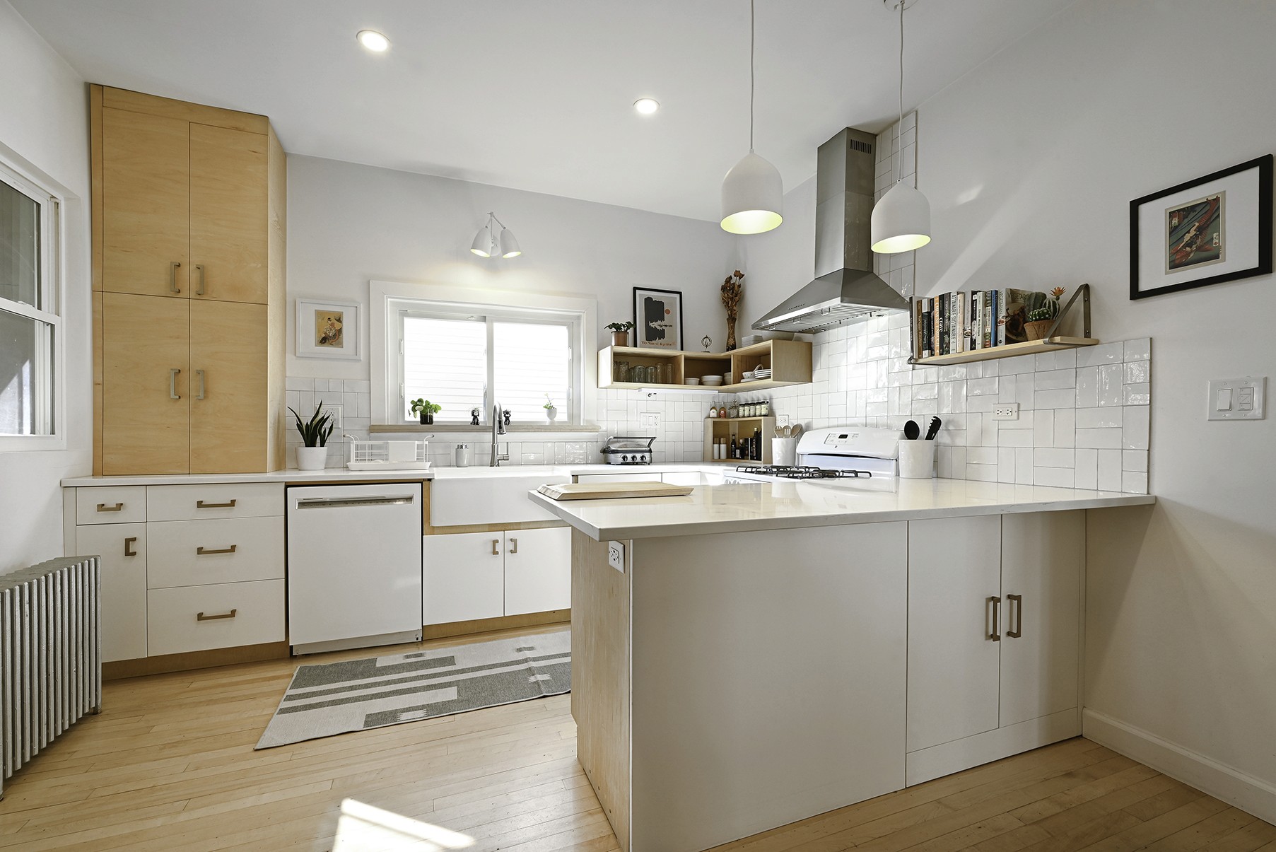 Modern kitchen design with white and natural wood cabinets