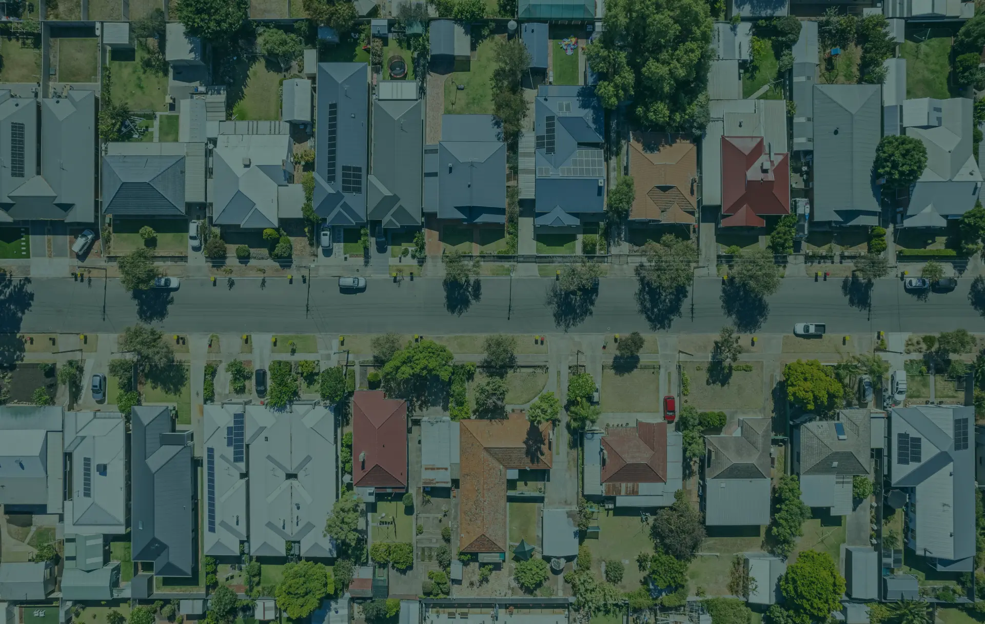Aerial view of suburban houses and streets.