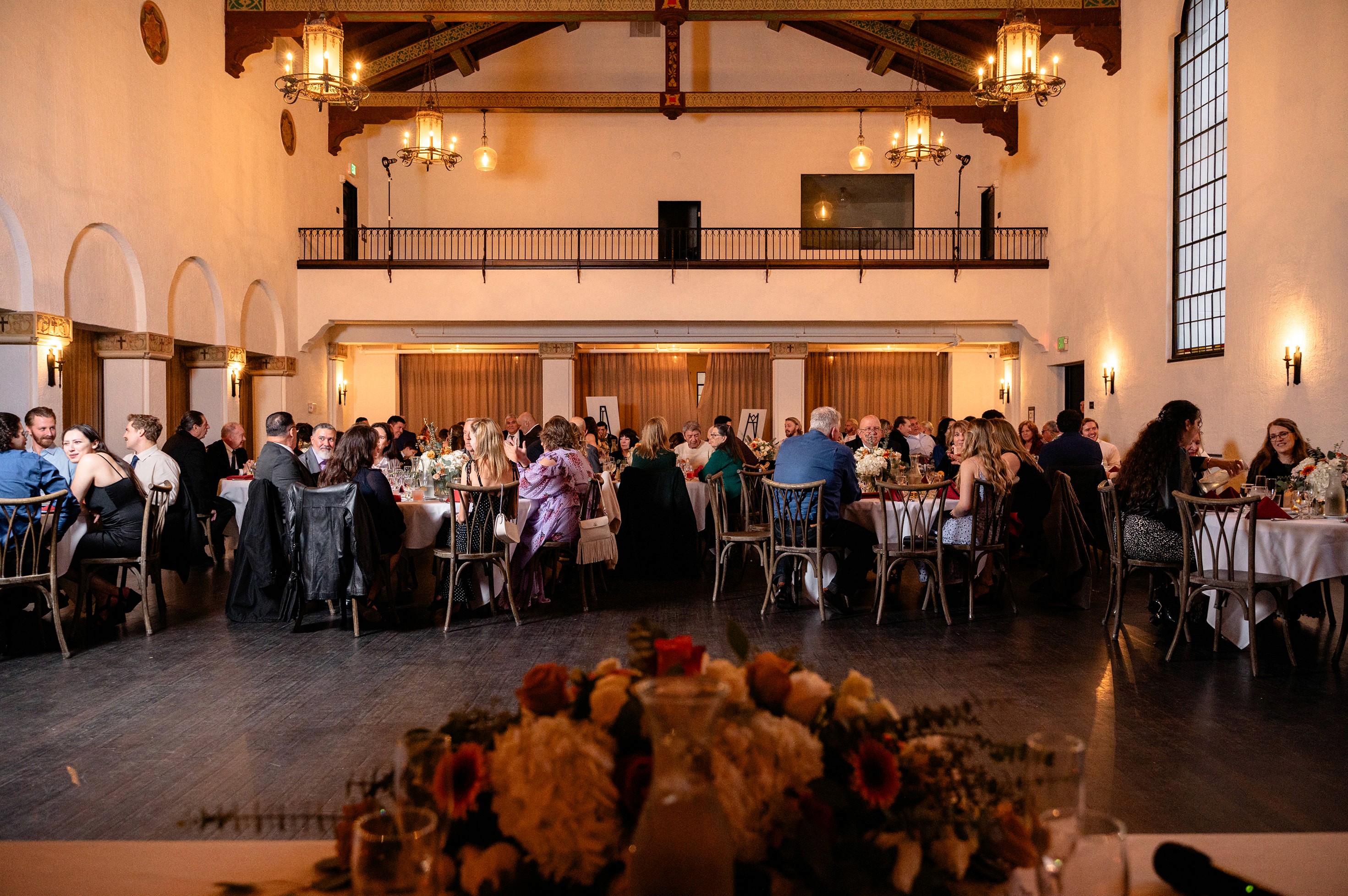 Flat lay wedding details with bouquet, rings, and sparkling bridal heels