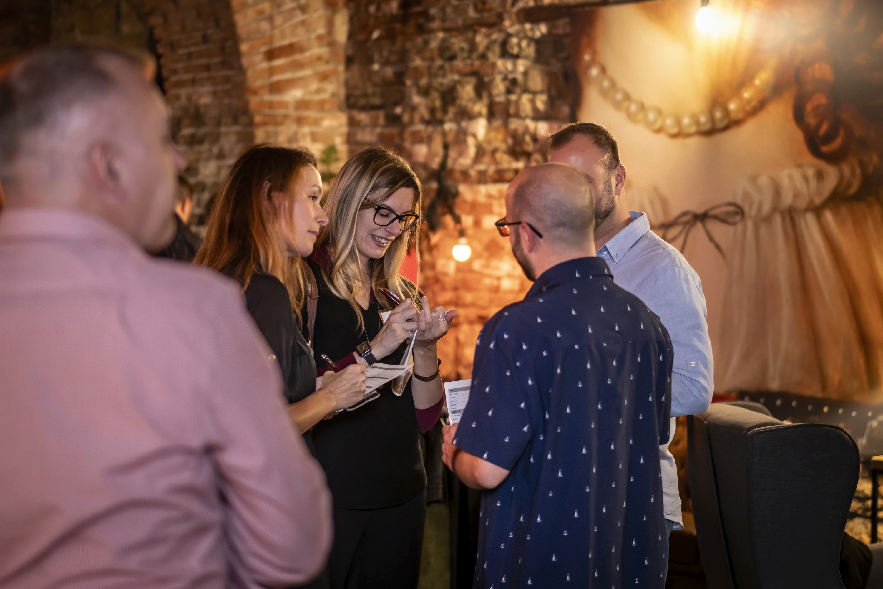 Conference guests exchanging ideas during an informal networking moment.