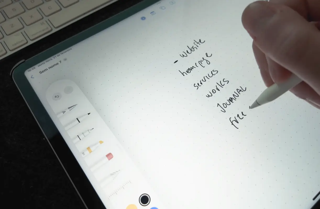 Sketching ideas and structuring website content on tablet