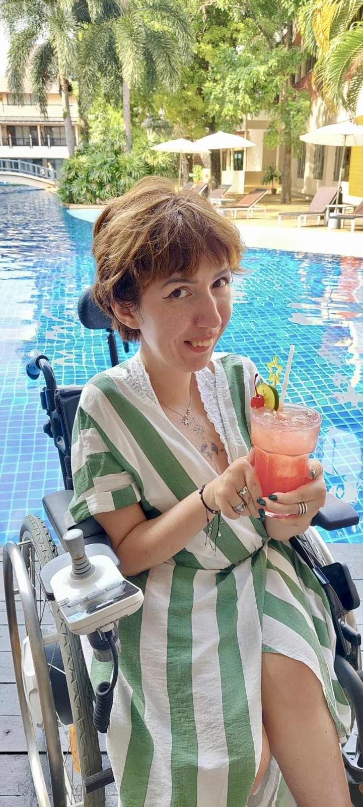 yellow Labrador retriever biting yellow tulip flower