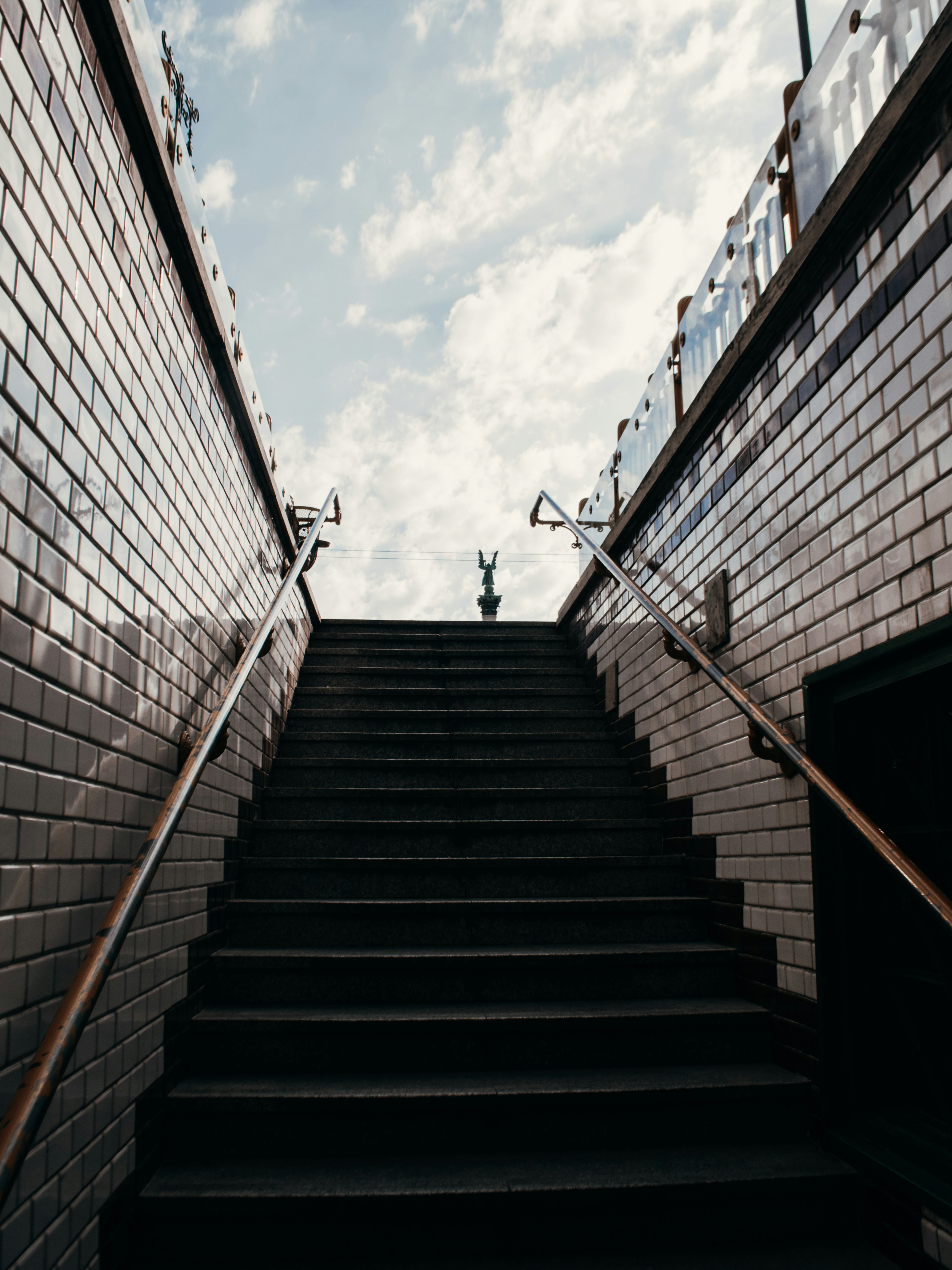 stairs from the subway with a view of the sky