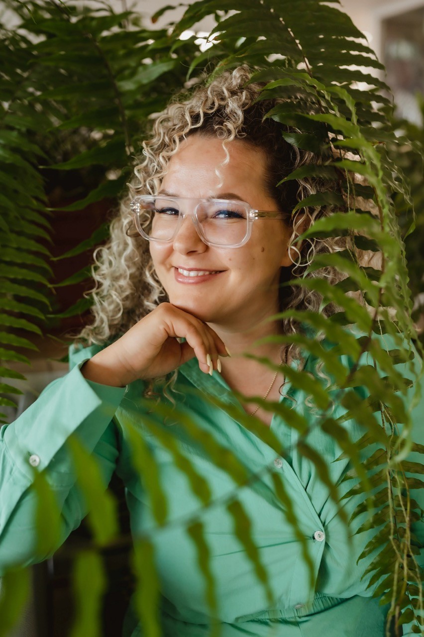Fashion photoshoot with a woman posing in a dress