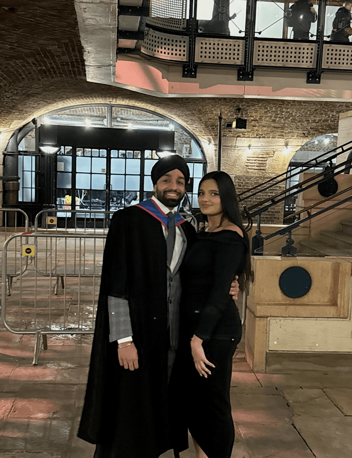 Couple portrait with dog on field