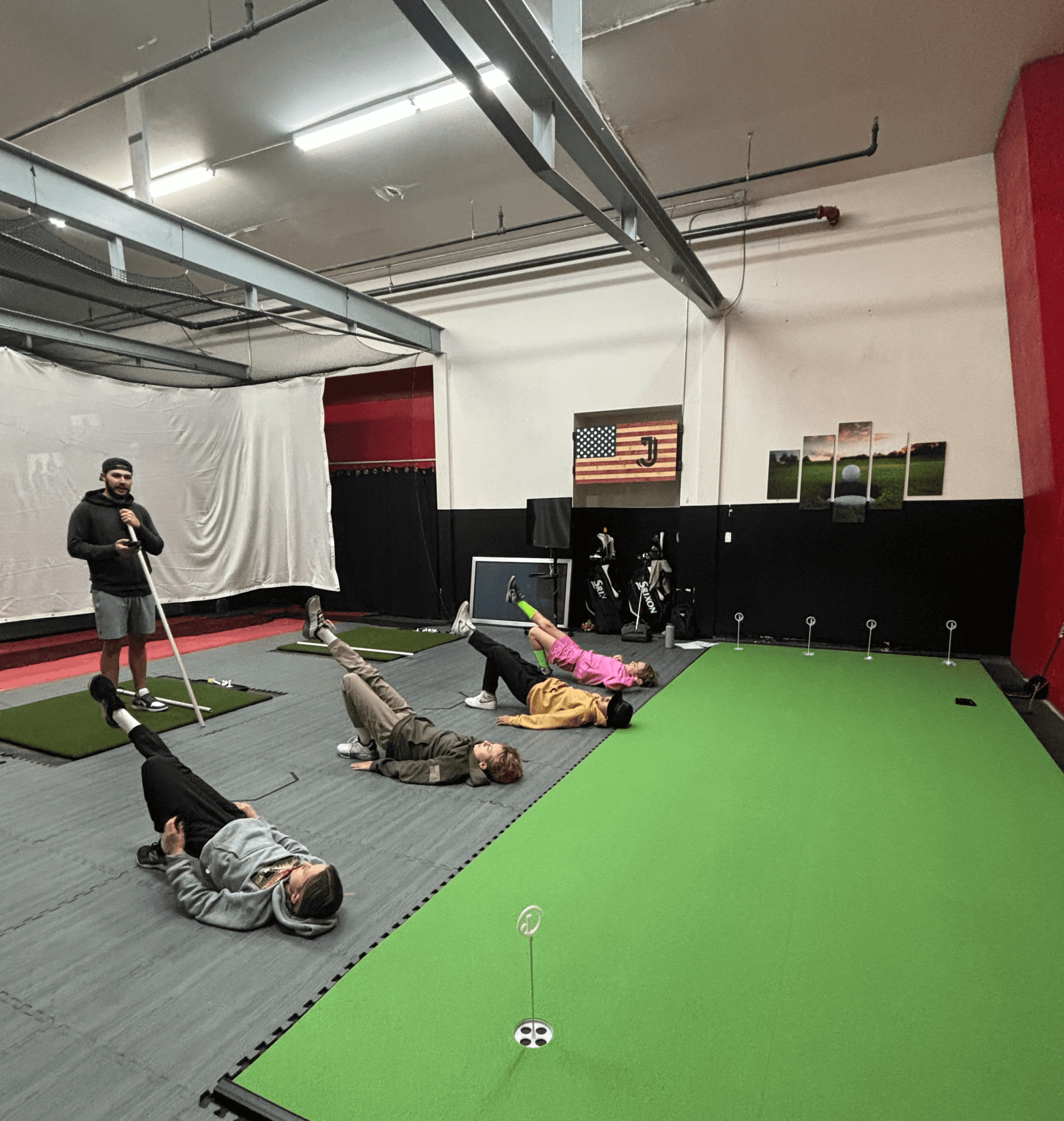Jack running students through exercises at an indoor facility.