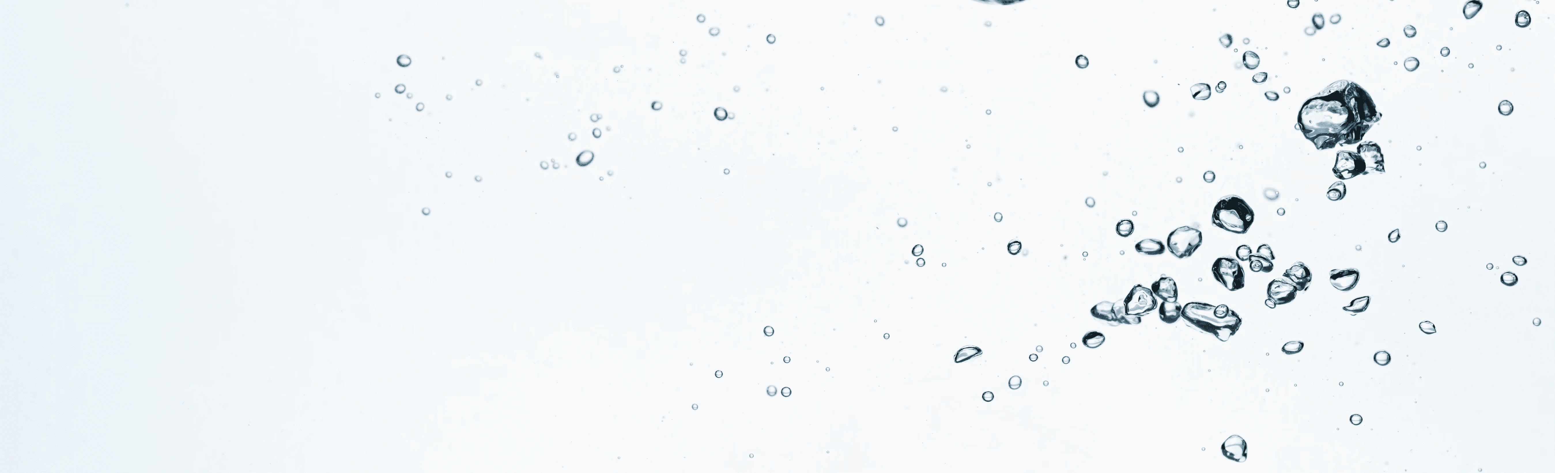 A glass of water with a splash of water in it