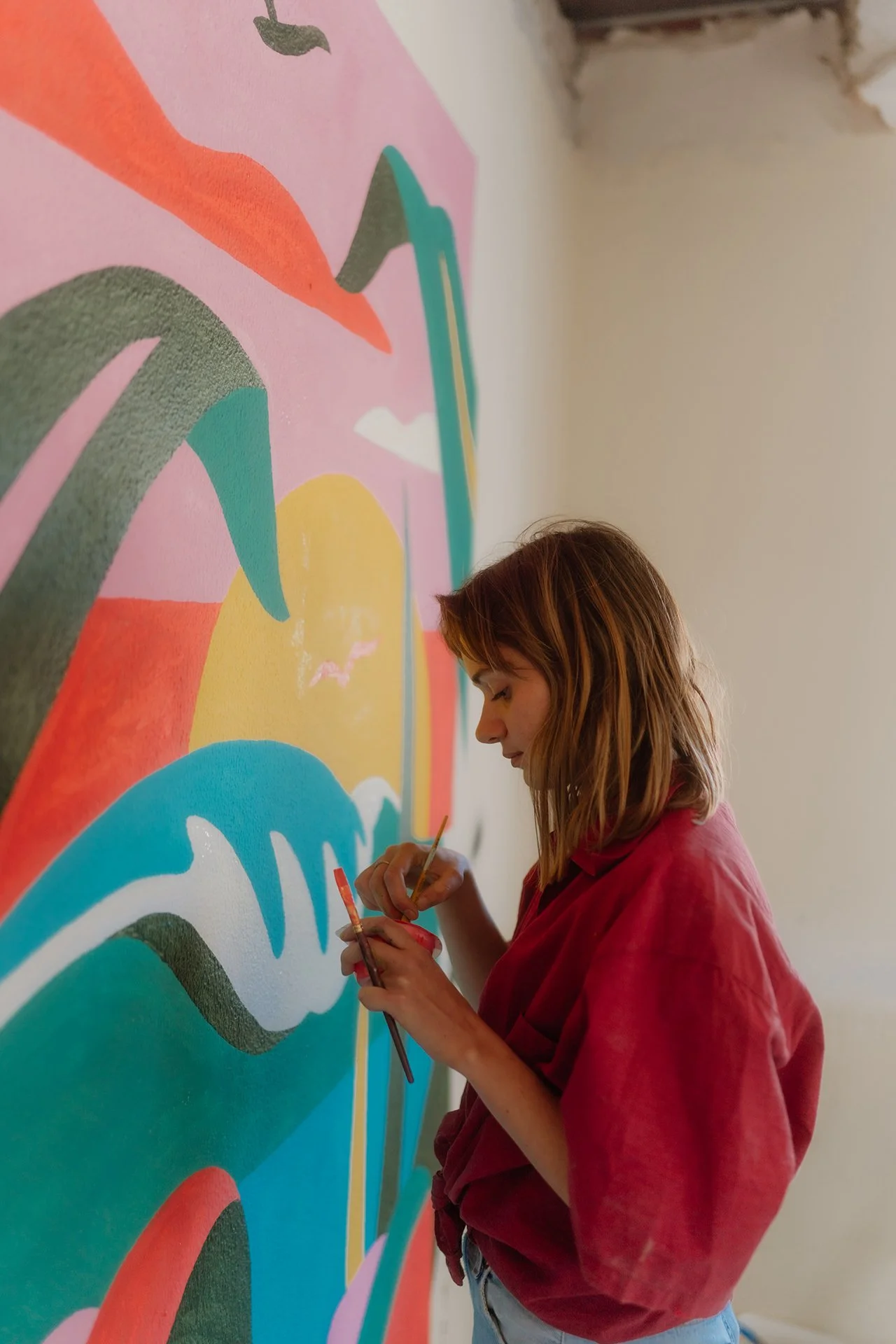portait of a woman painting on a wall