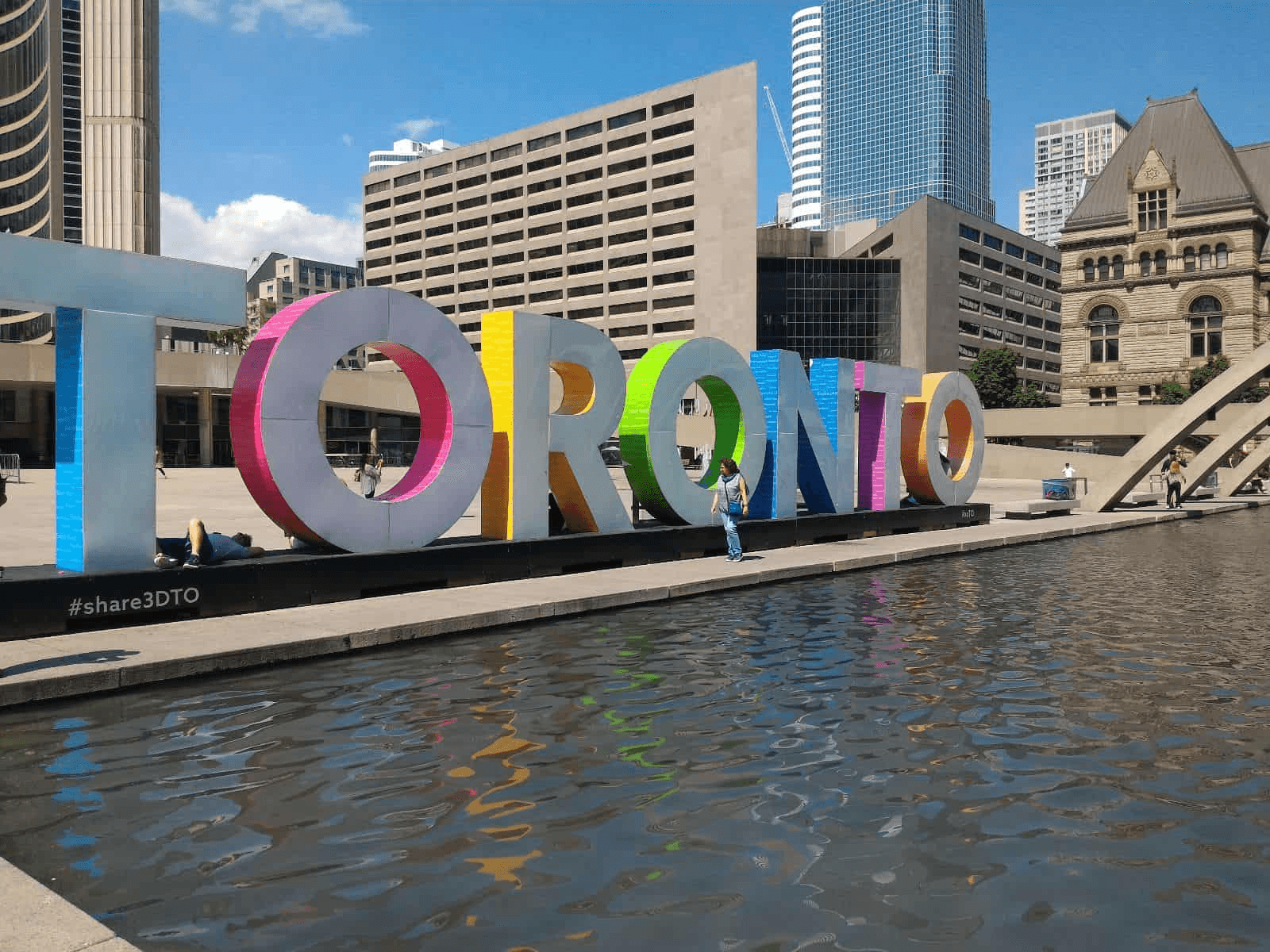 a large sign made of letters that spell "Toronto"