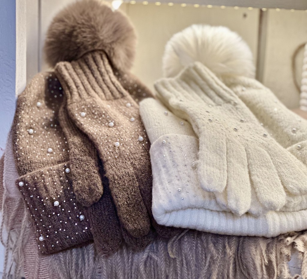 winter gloves and beanies with sparkling diamond-like stones on them