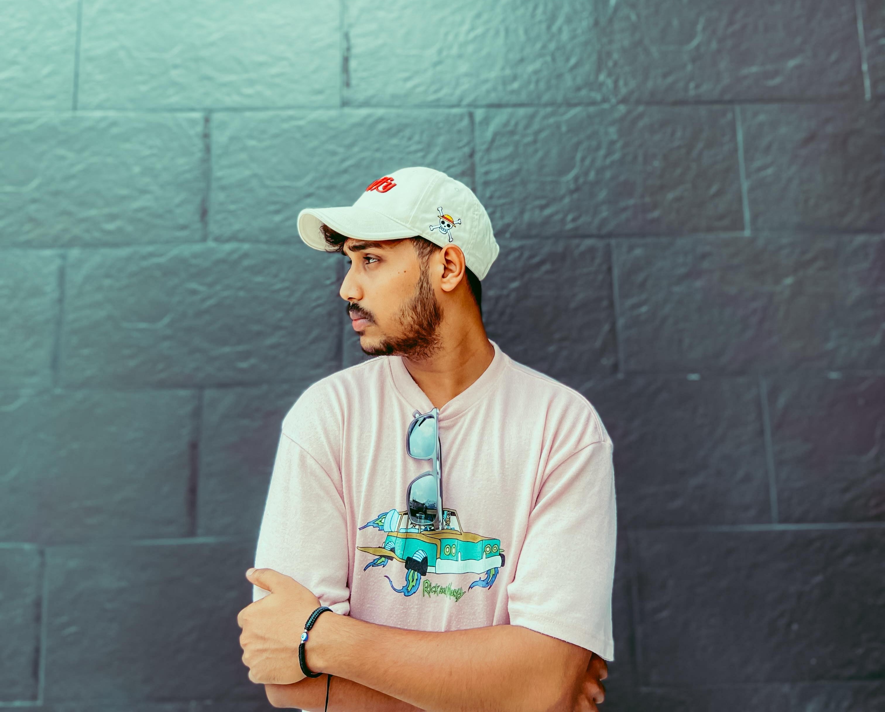 A boy in shorts and cap on his hat