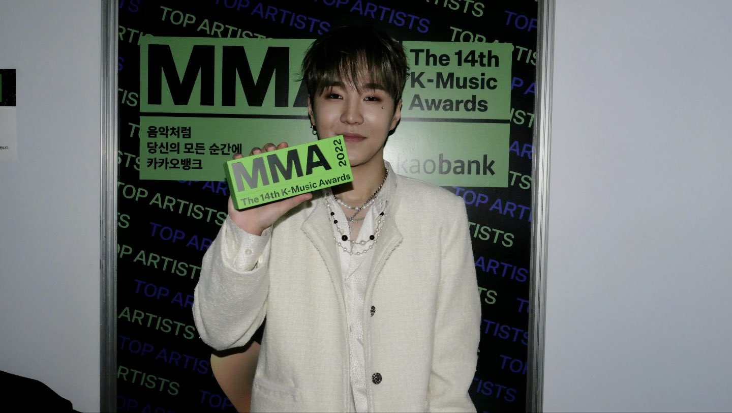 Streetside billboard with flyposters of the Batch.Works brand and illustrations