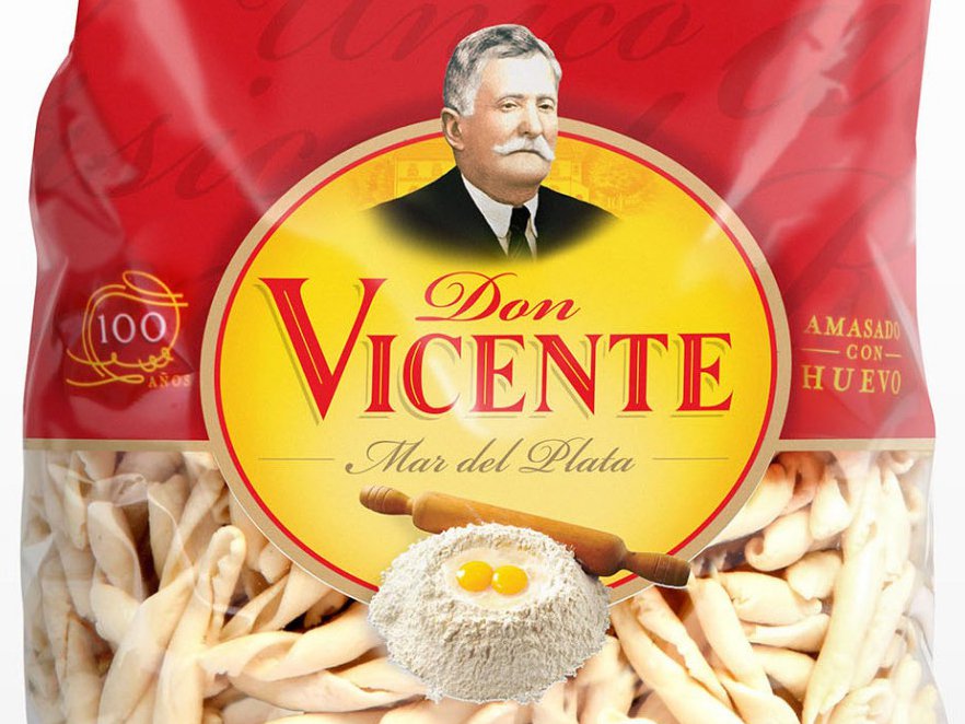 Rooftops of a coastal town with the sea in background