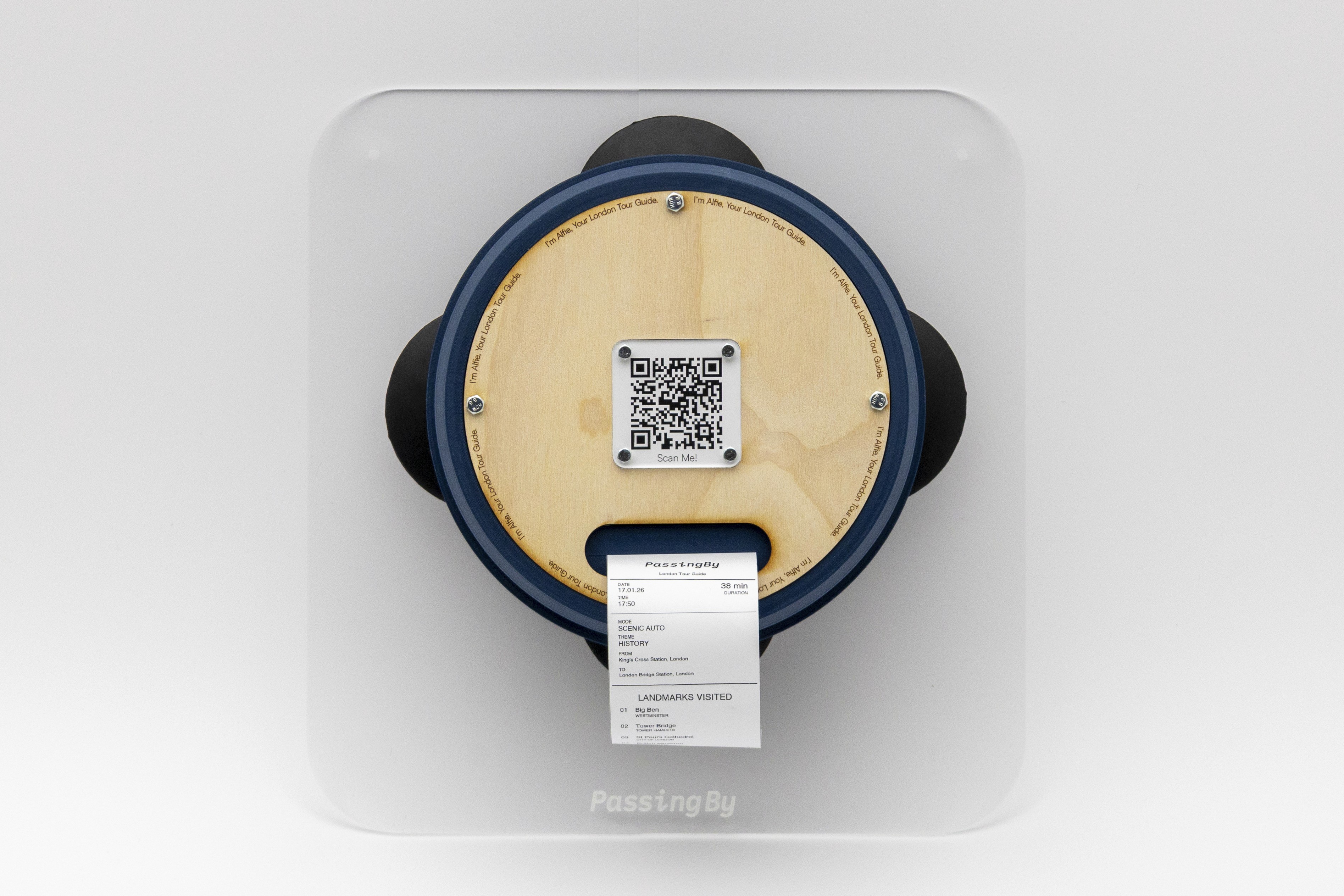 man wearing grey t-shirt standing in front of man sitting on chair