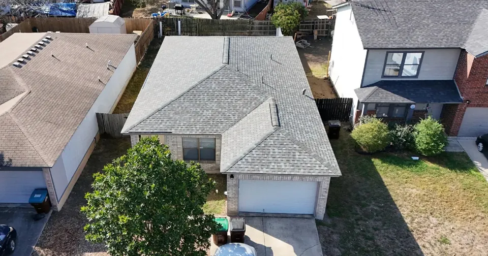 Drone view: San Antonio Atlas Coastal Granite shingle roof; roof overview used to introduce the installation topic.