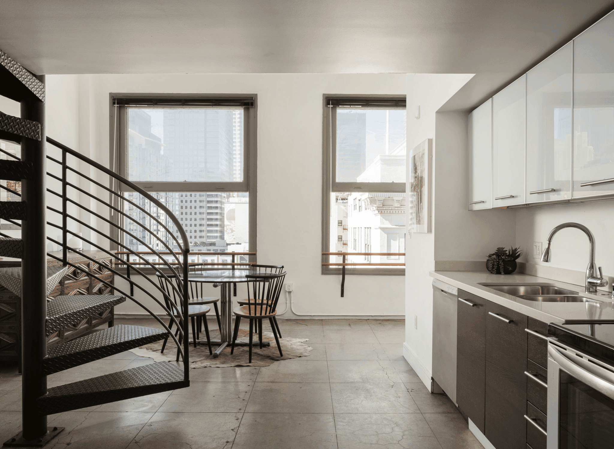 Open-concept loft interior with spiral staircase at The Judson Downtown Los Angeles.