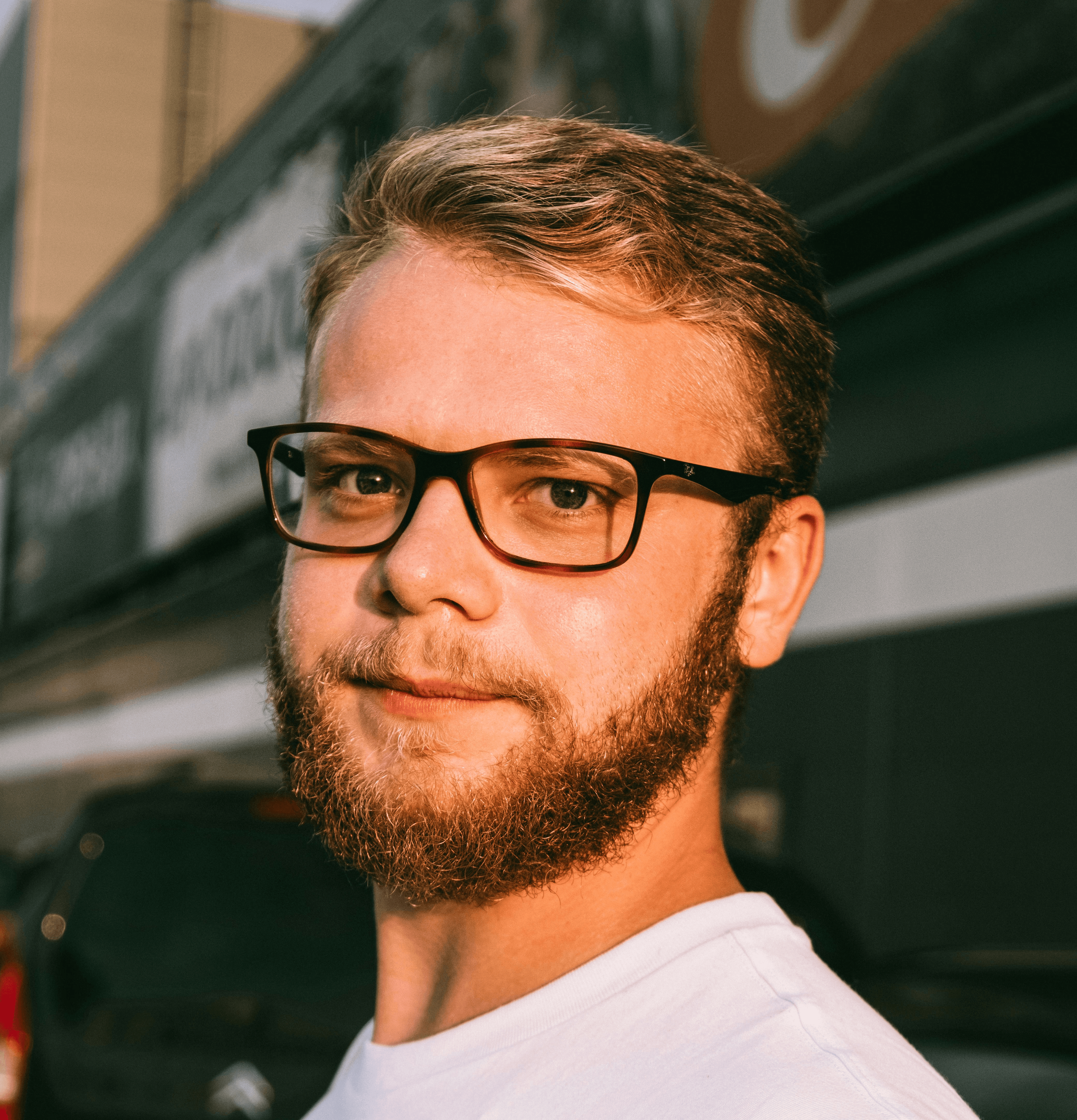 man in white crew neck shirt wearing black framed eyeglasses