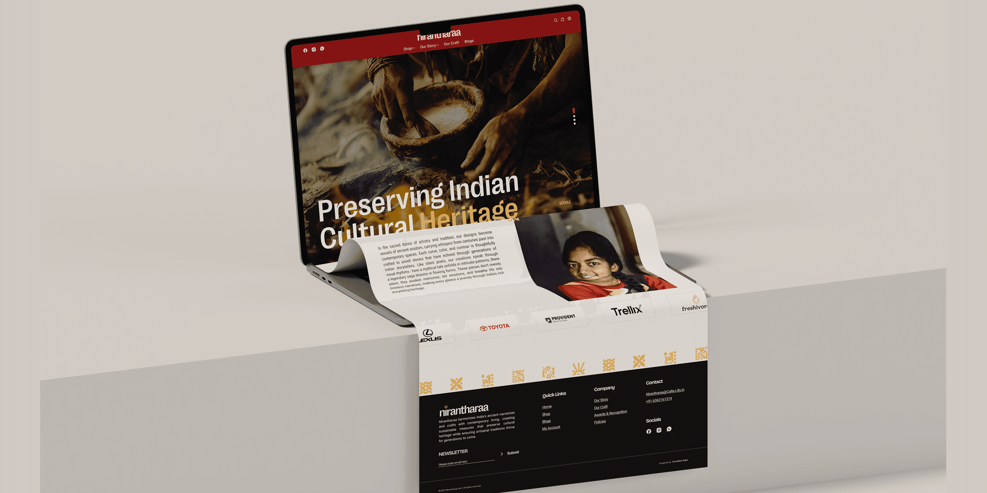 A 3D-rendered mockup of a laptop displaying the Nirantharaa website, with a creative paper curl effect extending from the screen. The website showcases Indian cultural heritage with earthy tones, traditional imagery, and brand partnerships. The footer includes contact details, social links, and newsletter signup options.