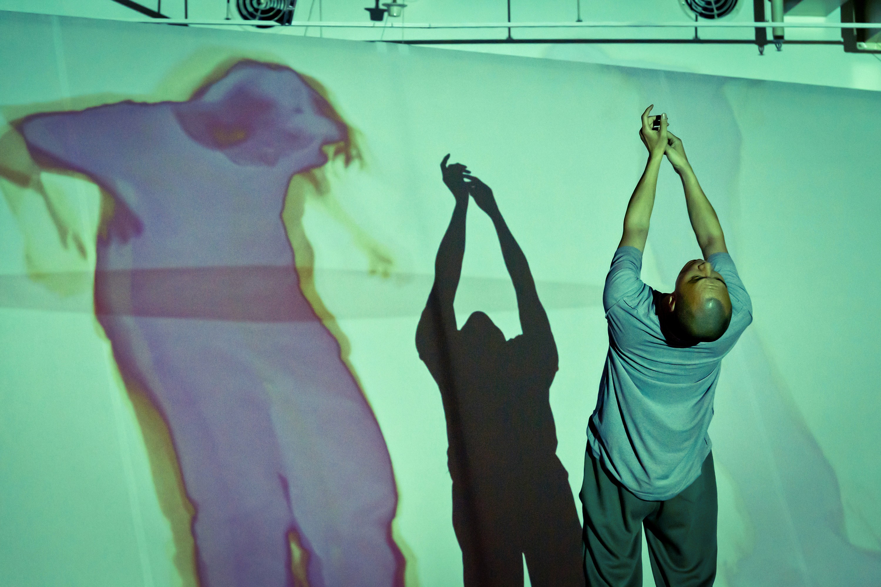 Sunlight casting shadows through orange blinds