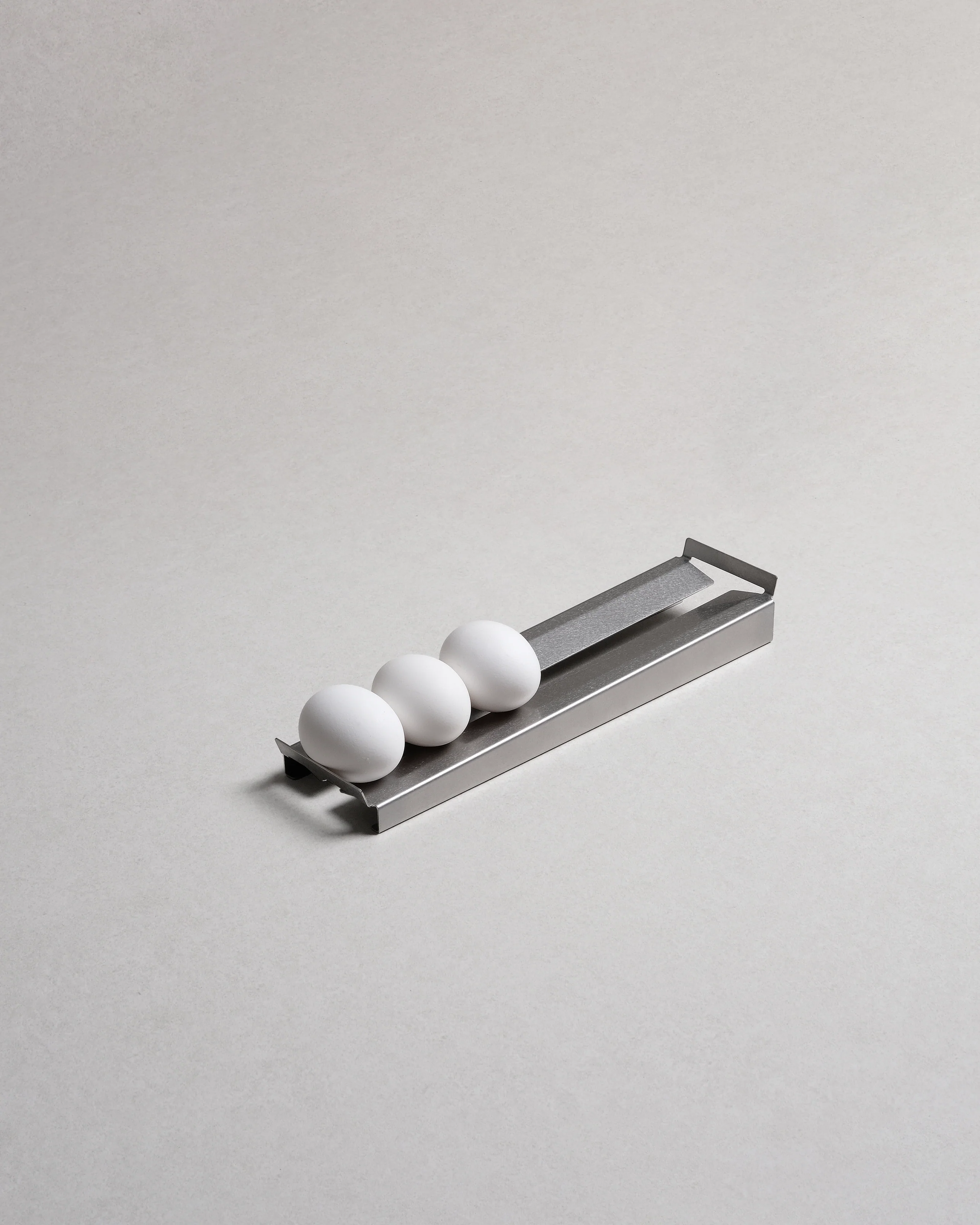 TactileEveryday Slope, egg tray laser cut and bent from a single stainless steel sheet