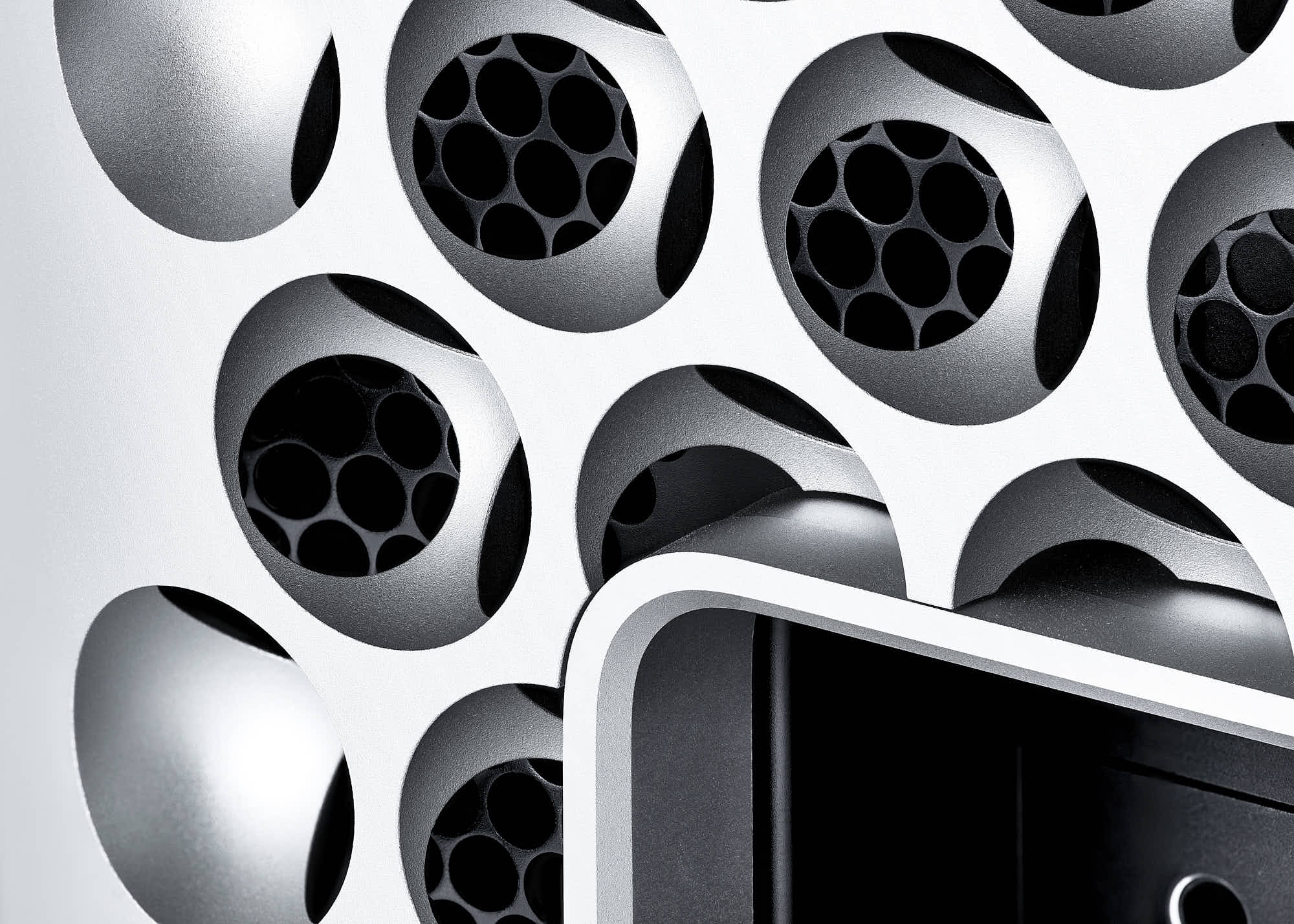 Close-up of a computer case with a distinctive lattice design for optimal airflow and cooling.