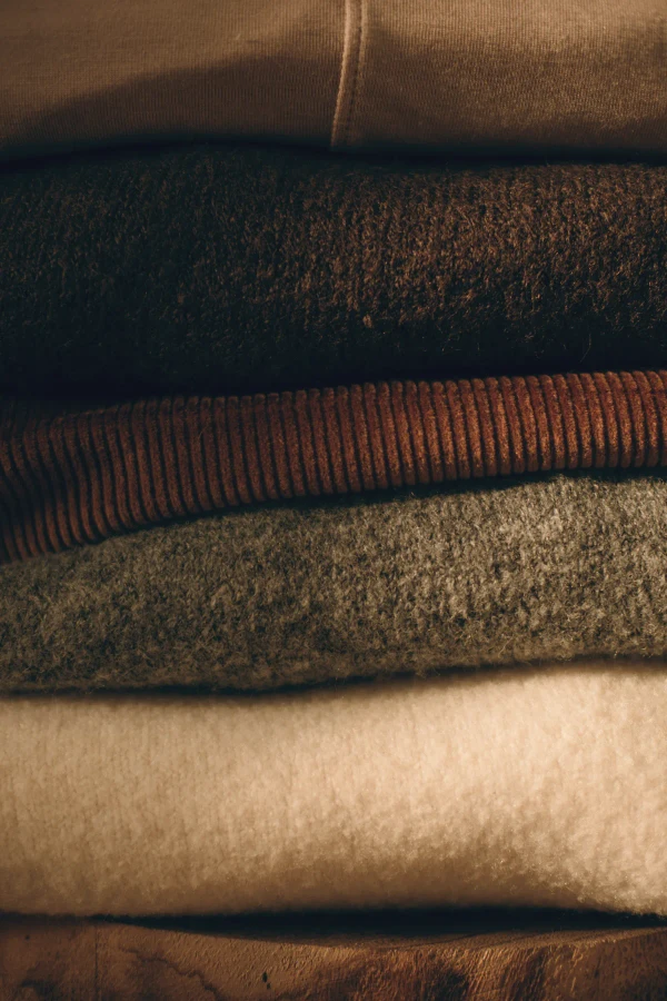 Folded knits from tobacco to ecru