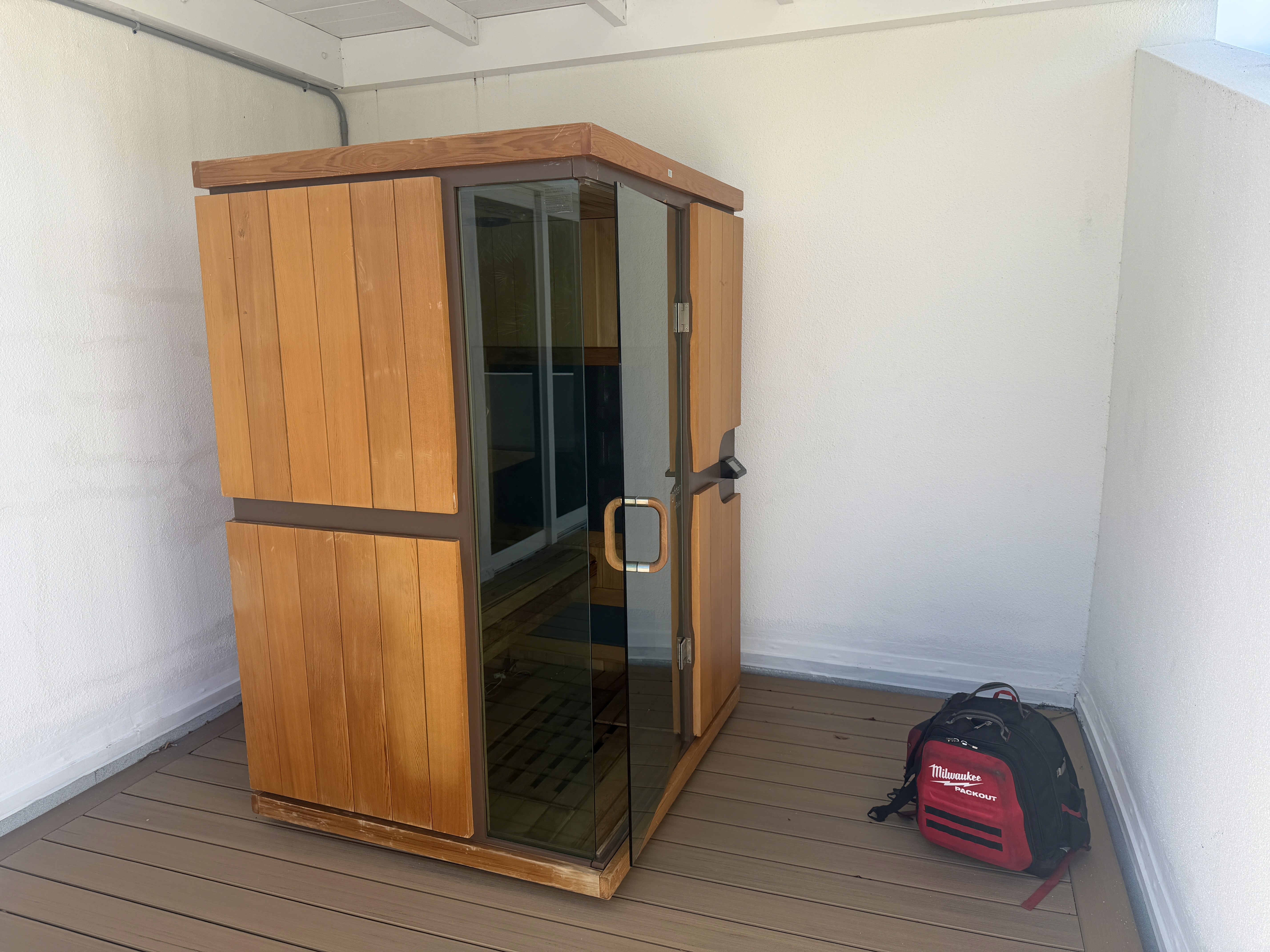 Sunlighten mPulse infrared sauna with a glass door, photographed during a Sauna Reparo service visit
