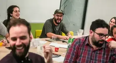 Bruno Pego smiling during a design sprint at Itaú Cubo.
