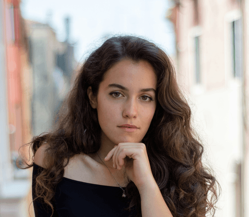 selective focus photography of woman wearing black off-shoulder blouse