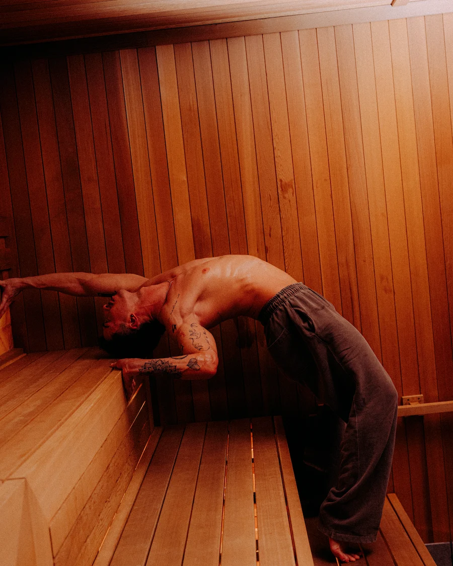 Example of lightweight, breathable shorts worn inside a sauna, illustrating practical options for what to wear in a sauna session that is movement-based..
