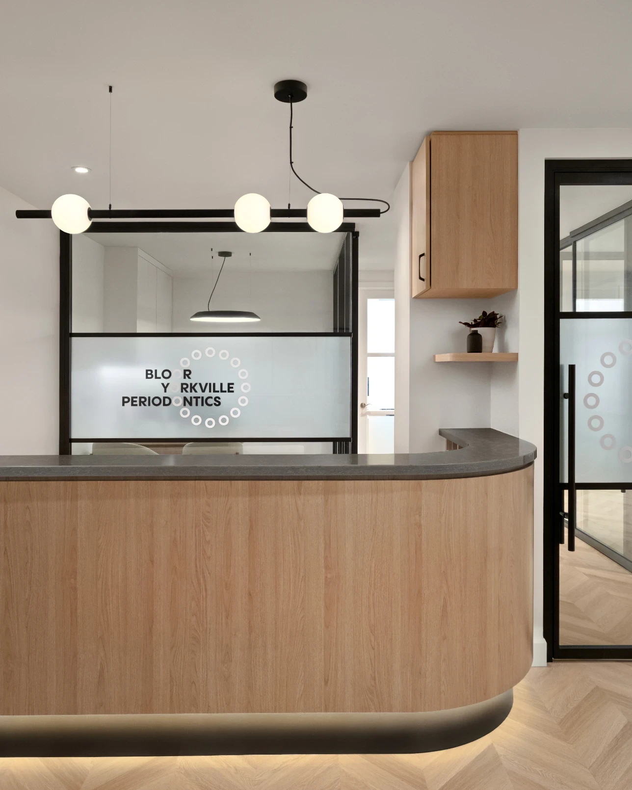 Front reception desk with Sovrle Dental logo at Sovrle Dental Clinic in North York, Ontario: the best dentist in North York, Ontario