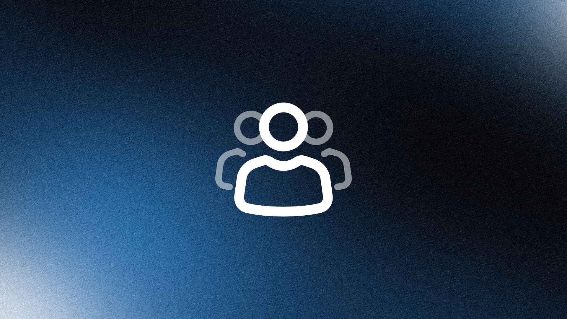 Man wearing a beige cap and dark shirt working on a laptop at a wooden desk with a plant in the background.