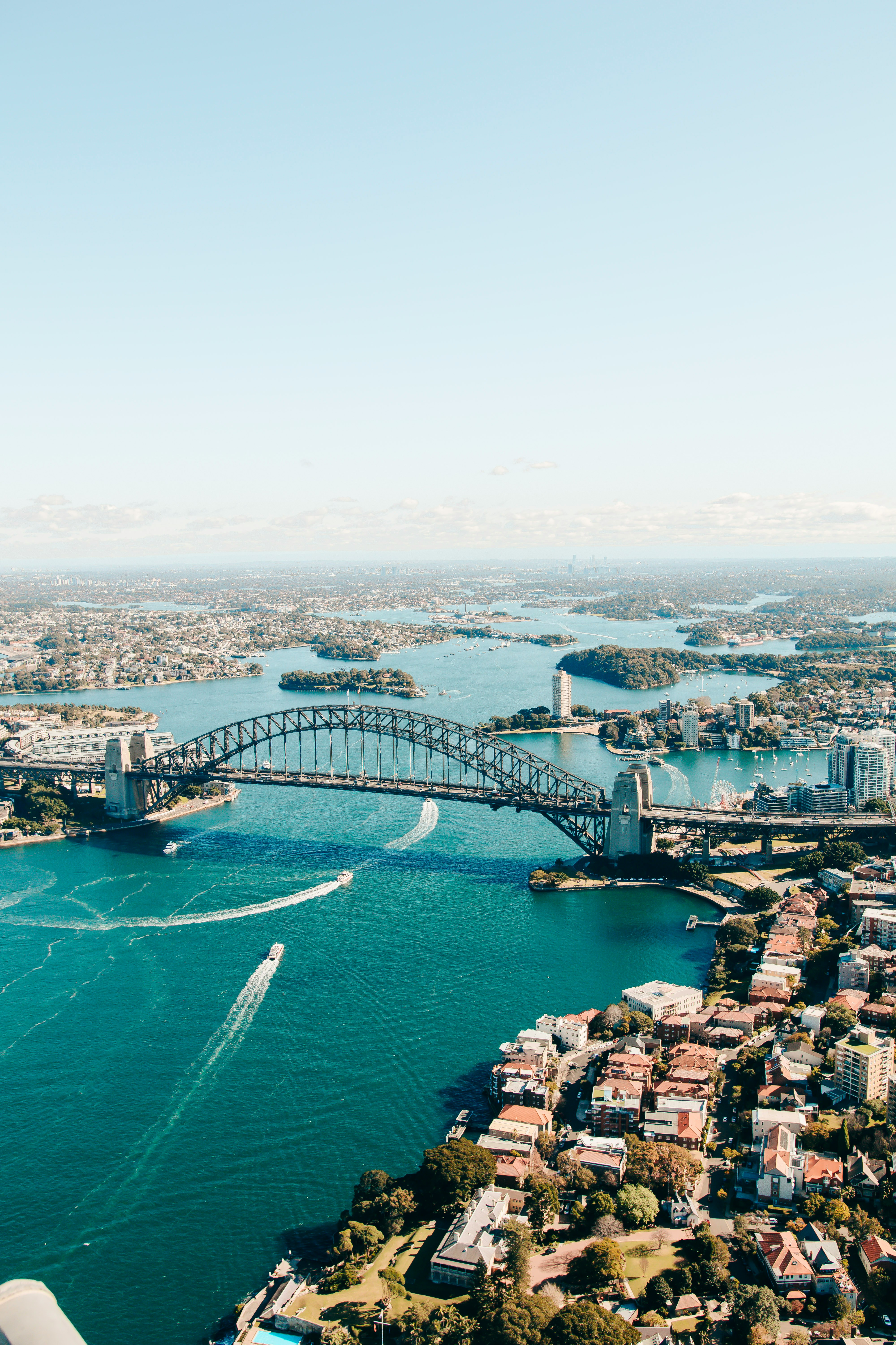 an aerial view of a bridge over a body of water