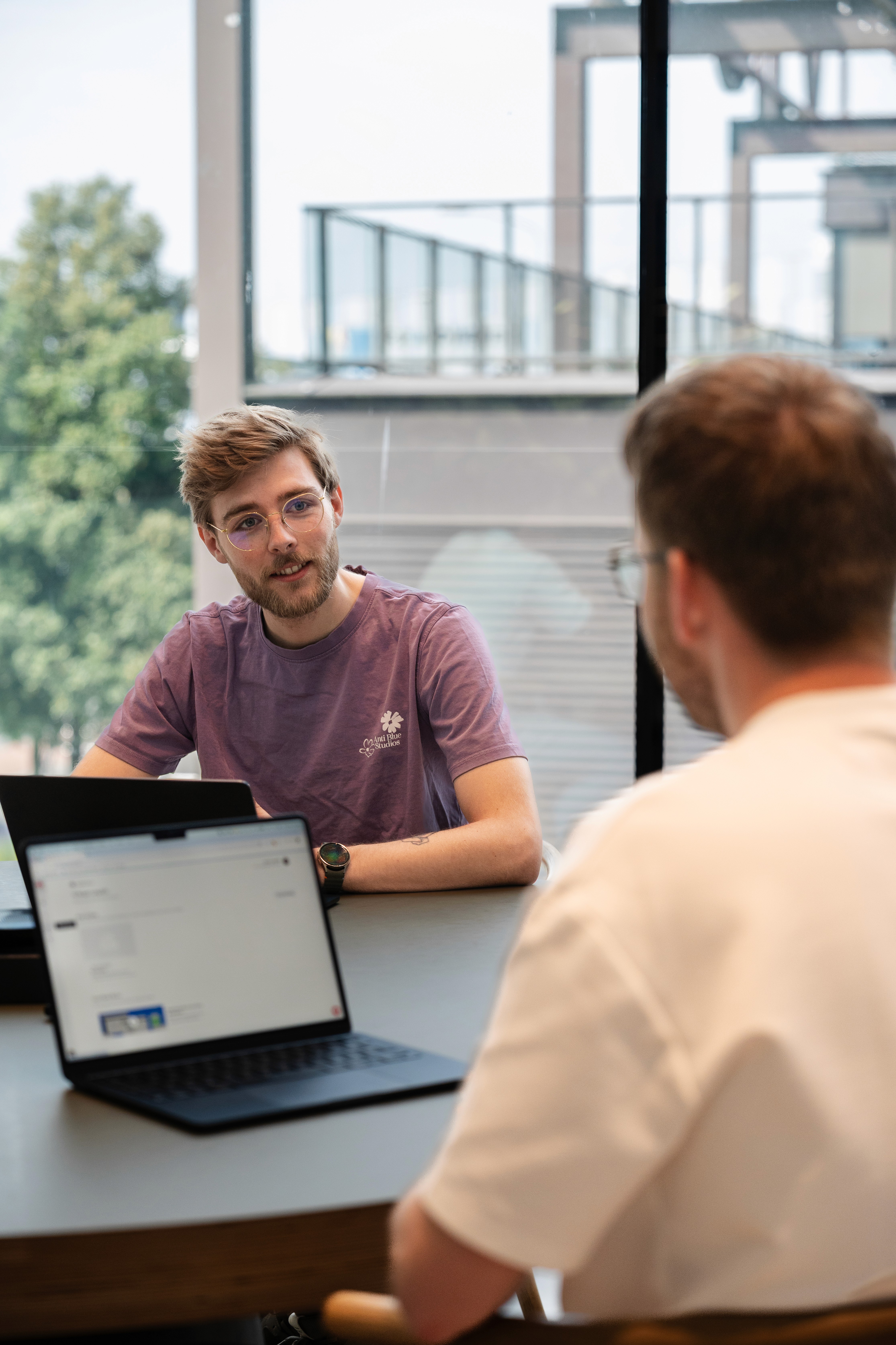 a living room with a couch a table and chairs