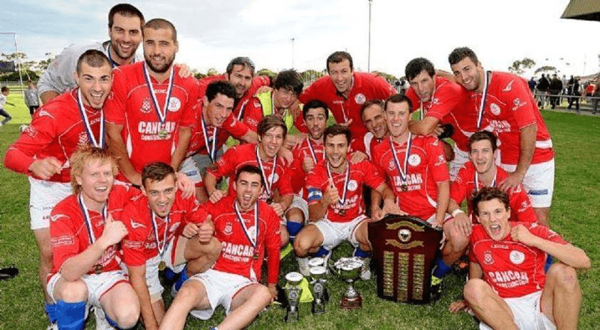 Older North Geelong Warrior's senior team celebrating