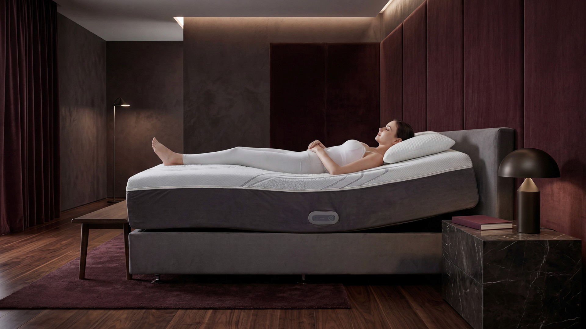 A fast black sports car races down the highway.