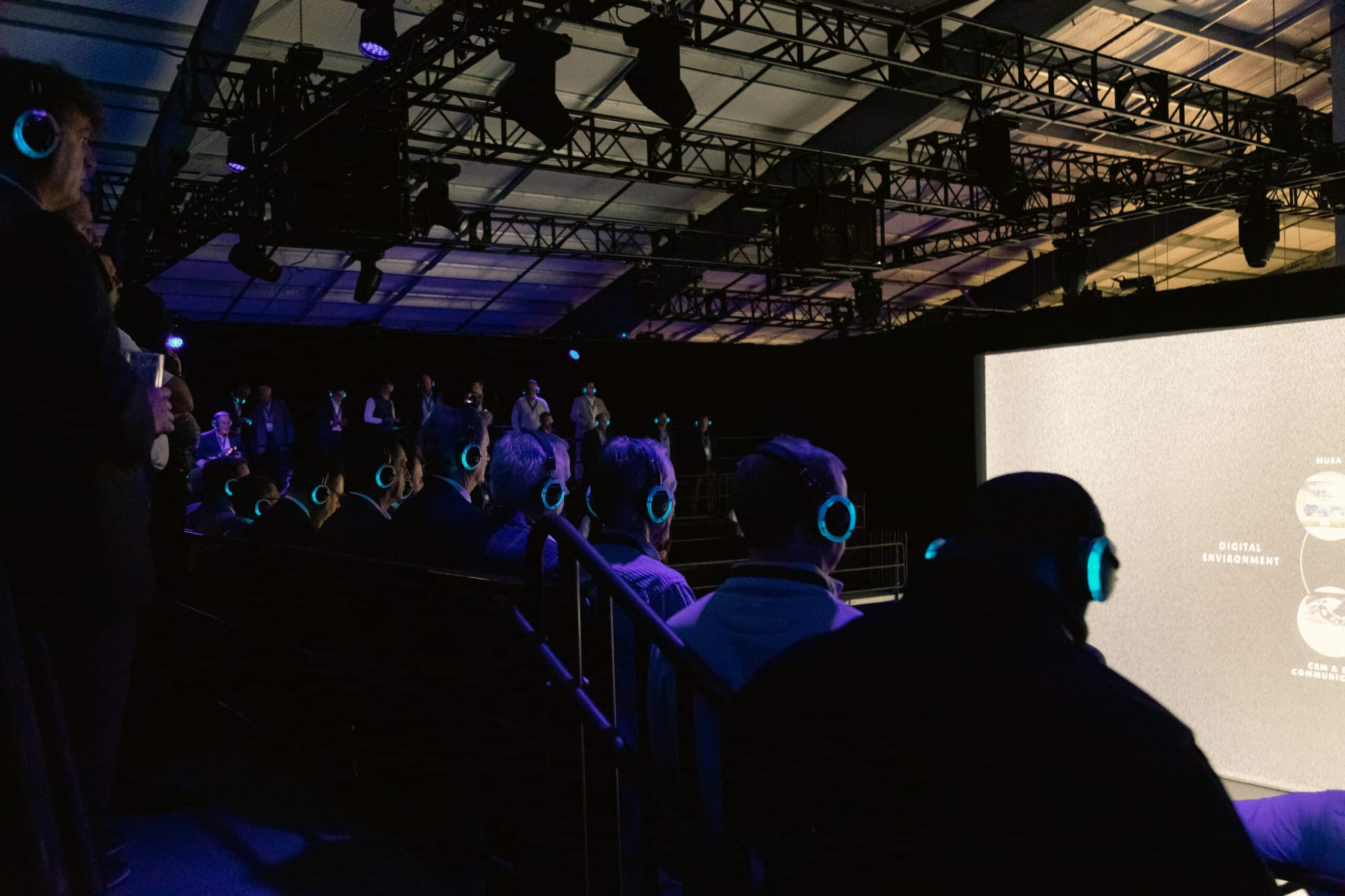 Mazda North America attendees wearing Aural Sound headphones