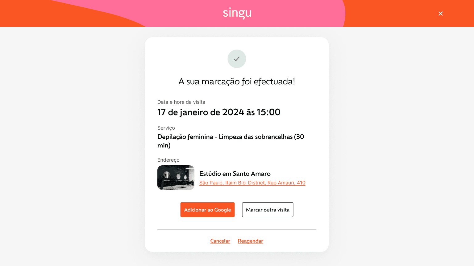 A cell phone sitting on top of a wooden table next to a keyboard