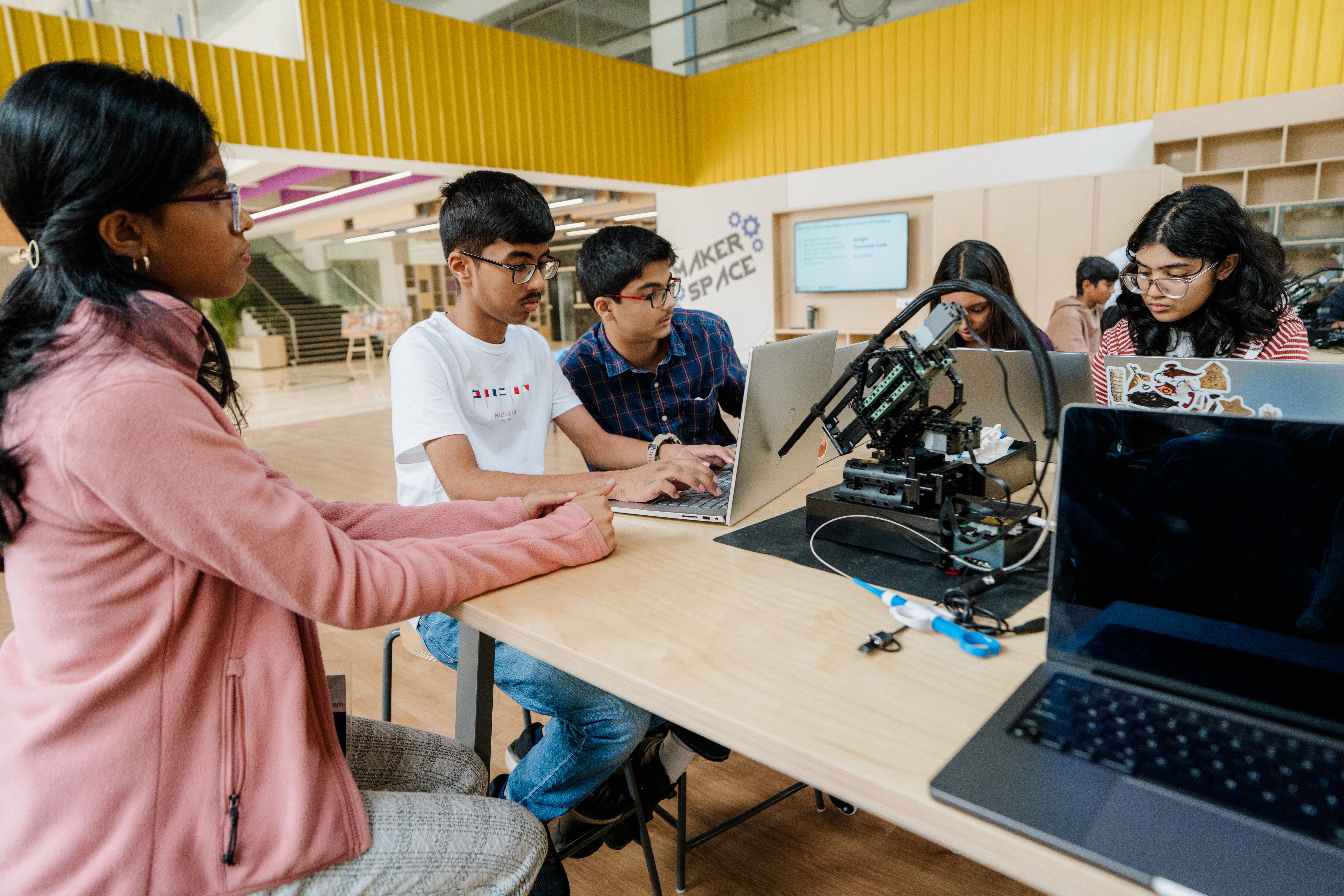Students making the use of technology for robotics