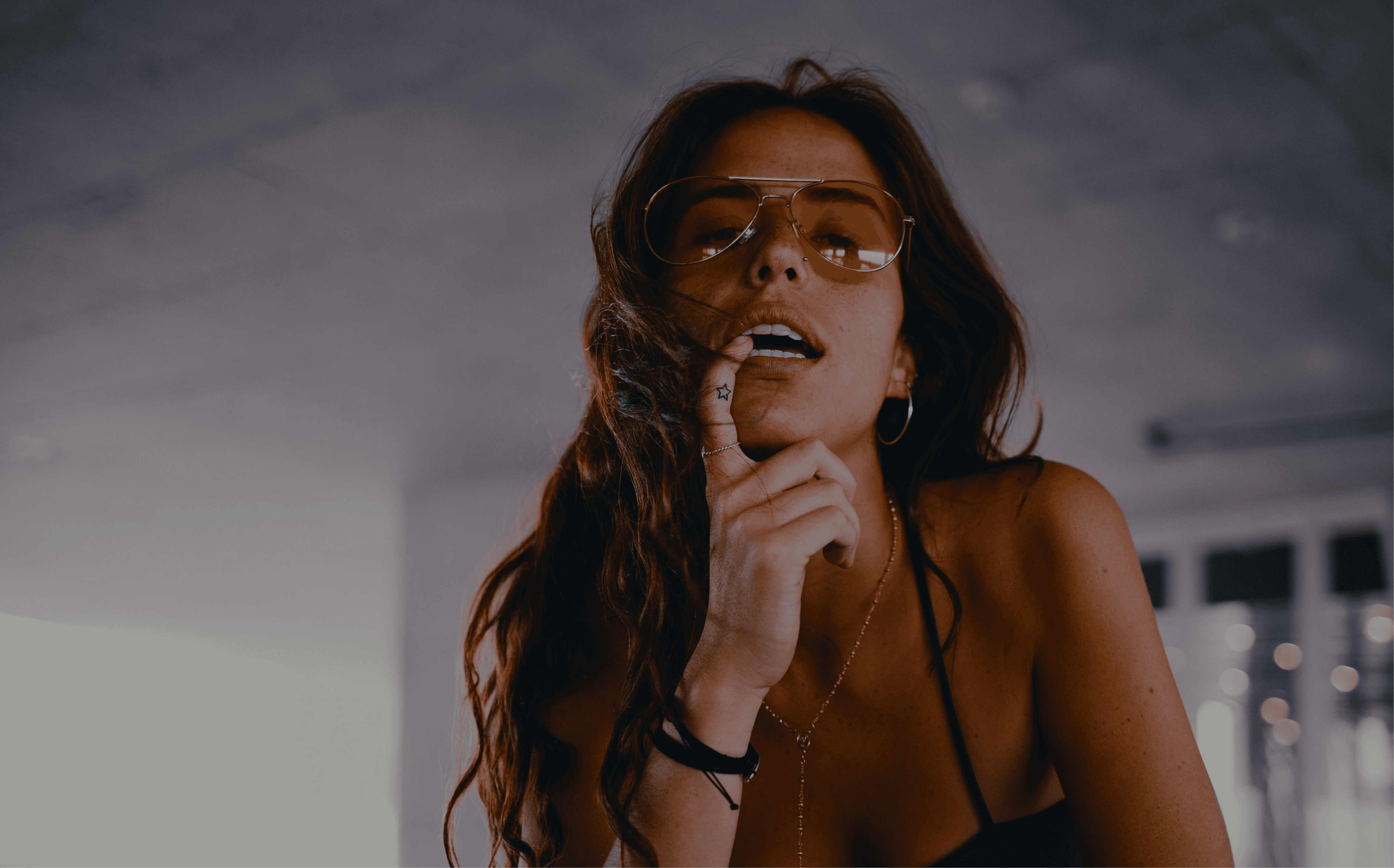 Abstract flowing waves in grayscale creating a smooth, undulating pattern with light and shadow gradients