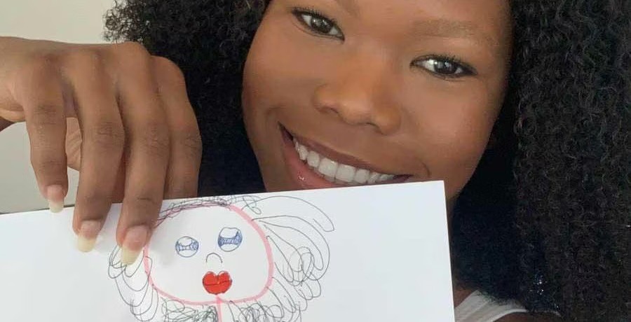 Babysitting Angel Alysha receives drawings from babysitting kids
